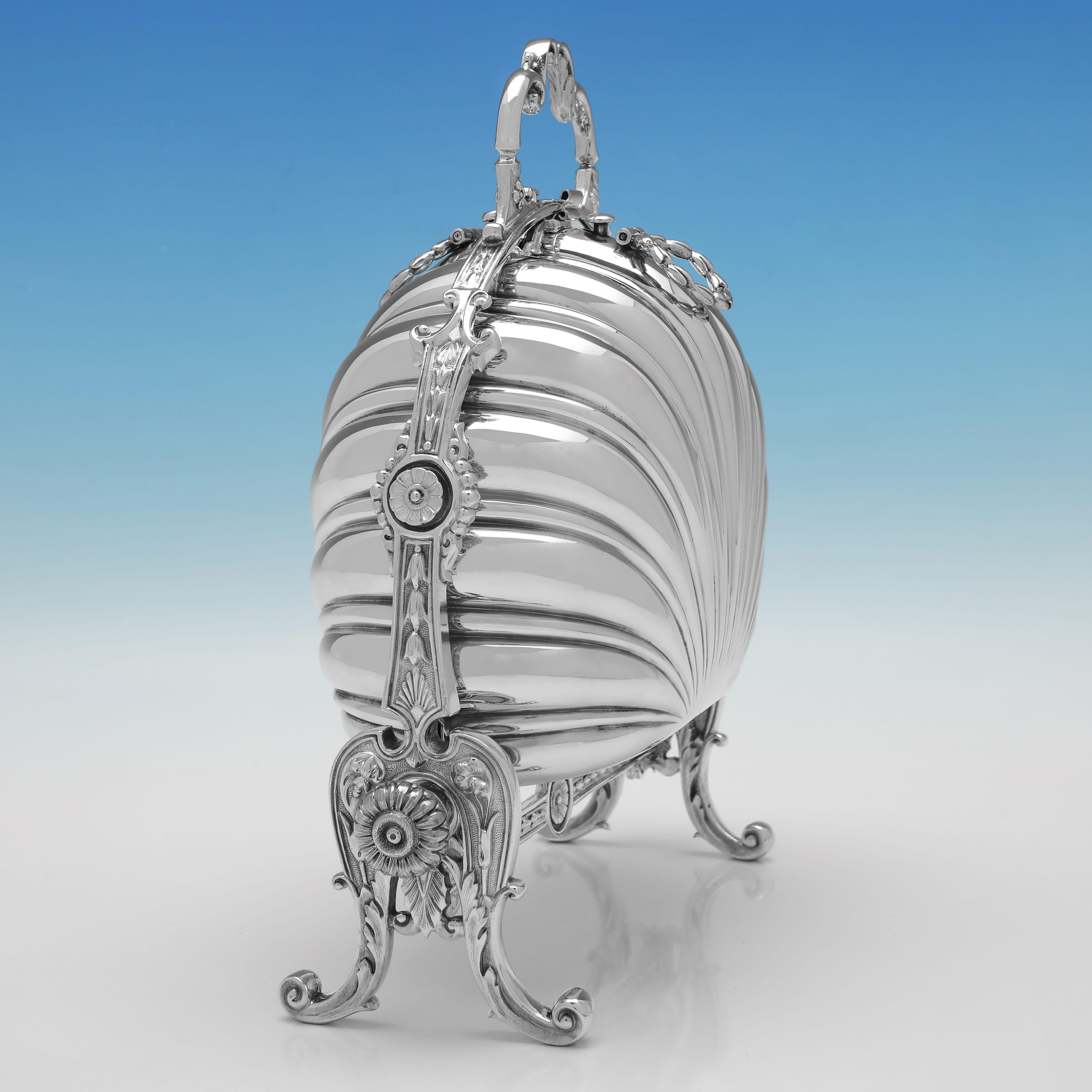 Made circa 1890 by James Dixon & Sons, this attractive, Antique, Victorian, Silver Plate folding Biscuit Box, is of traditional form, with push button opening to each side, and gilt interiors. The biscuit box measures 10.75