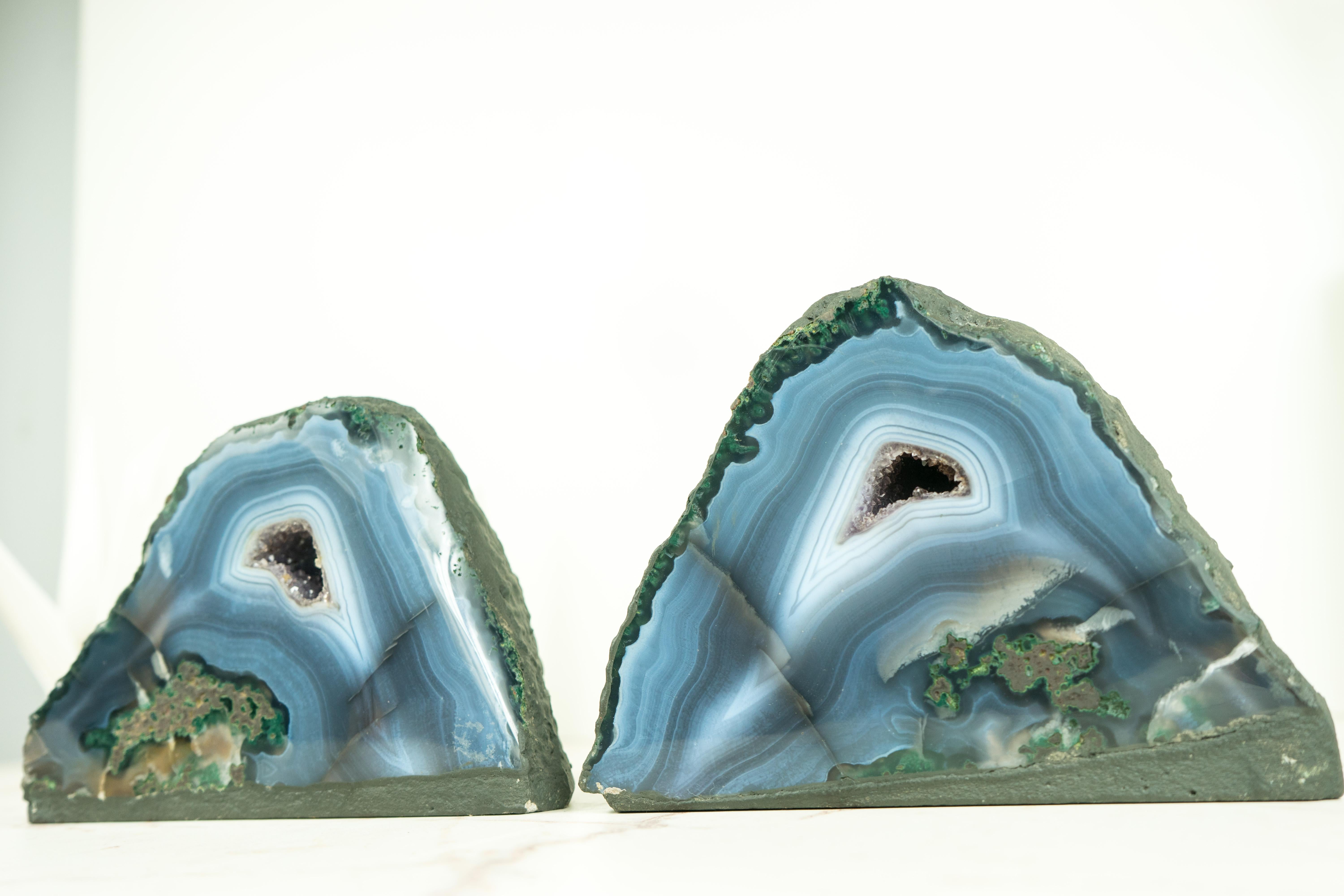 Set of a Book-Matching Pair of Blue and Green Lace Agate Geoes with Sparkly Crystal Core

▫️Description

With their stunning beauty, this pair of small blue agate geodes showcases a rare blend of colors and aesthetics. The rich blue, white, and