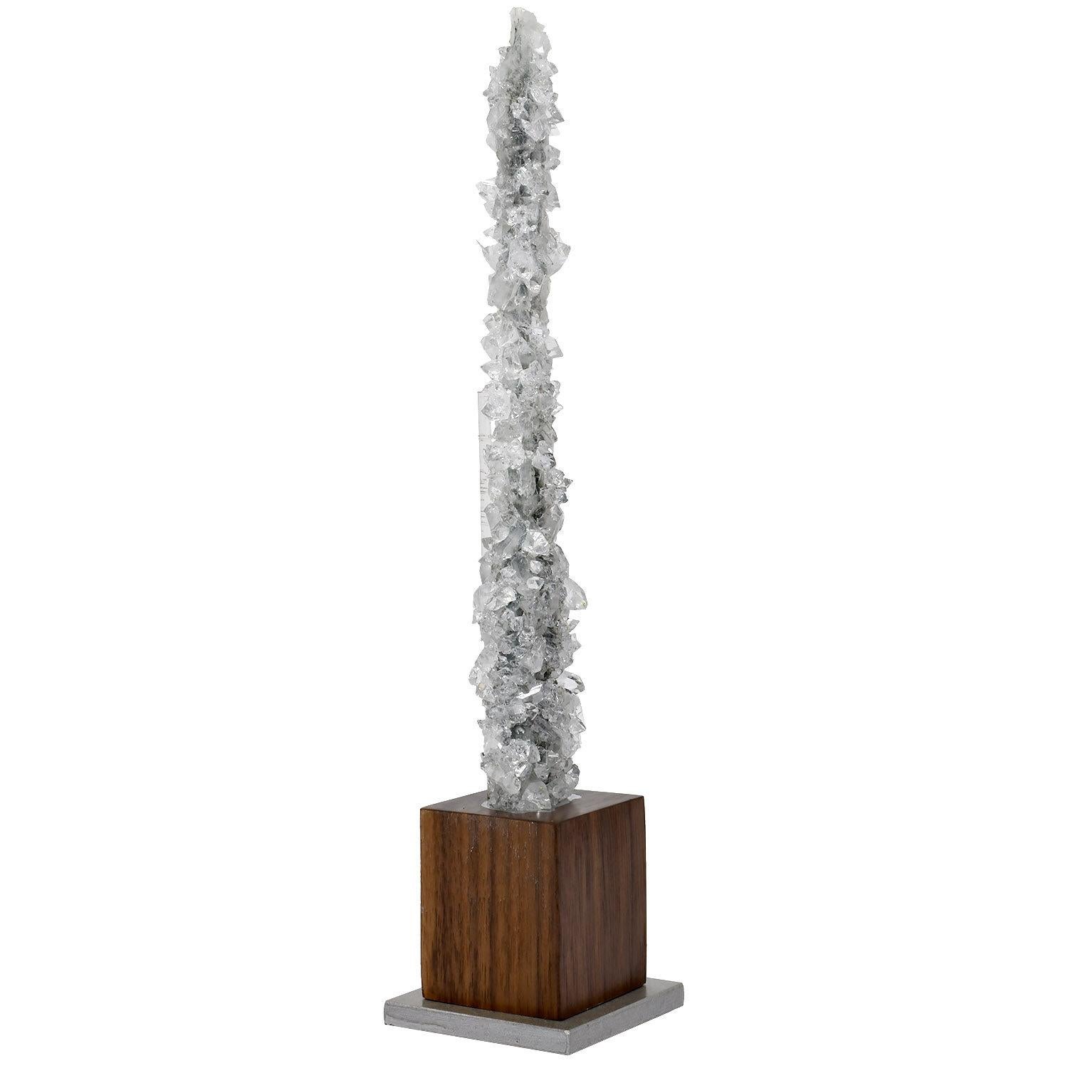 Naturally-formed mineral scepter: Clear Apophyllite from India

Height on custom display stand: 10.25 in. / 26 cm

Custom mounted on a nickel painted steel and walnut base with Lucite mounting rod.