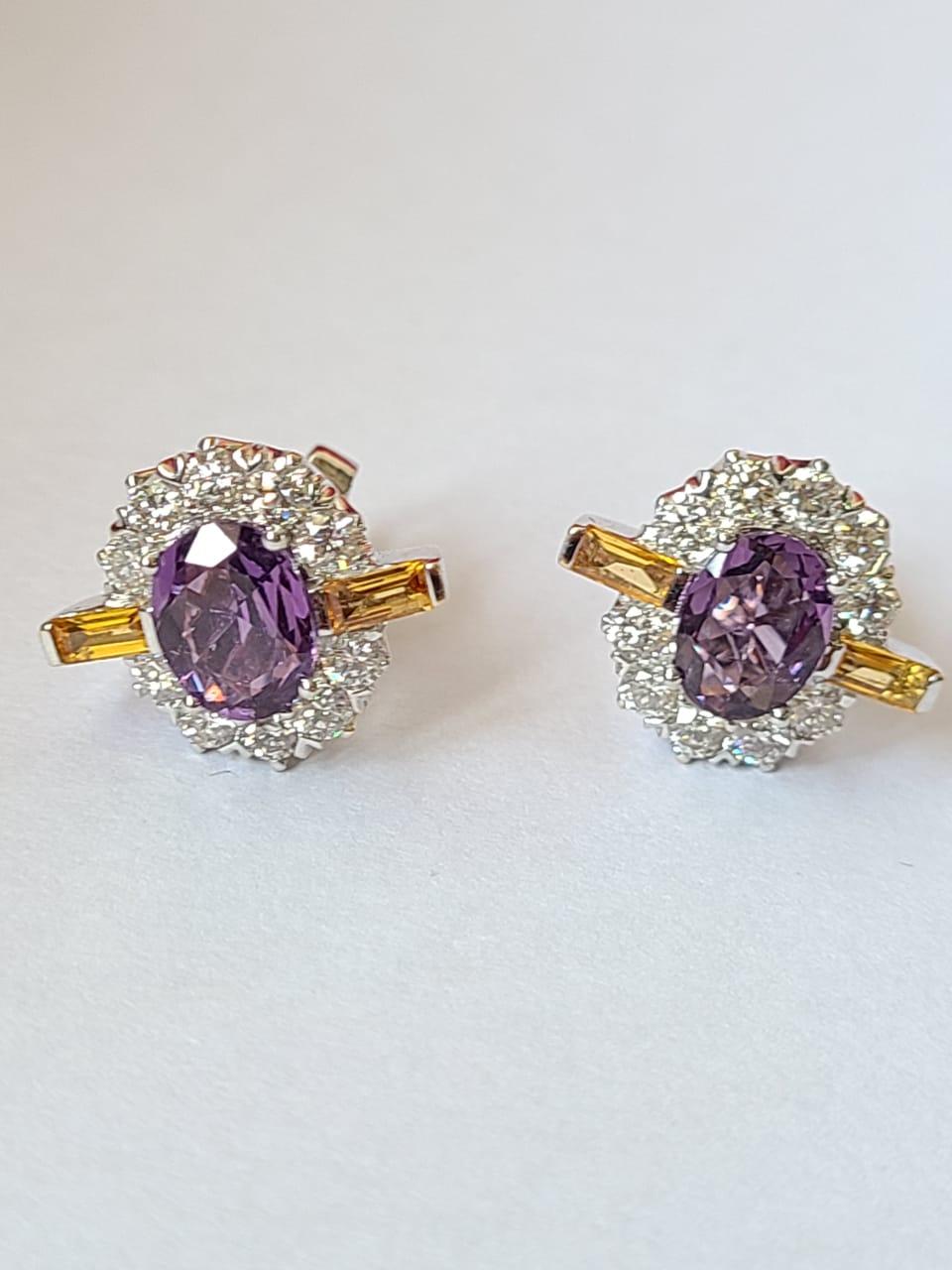 A very gorgeous and beautiful Purple Sapphires & Yellow Sapphires set in 18K White Gold & Diamonds. The weight of the Purple Sapphires is 2.31 carats. The Purple Sapphires are of Ceylon origin. The weight of the Yellow Sapphires Baguettes is 0.45
