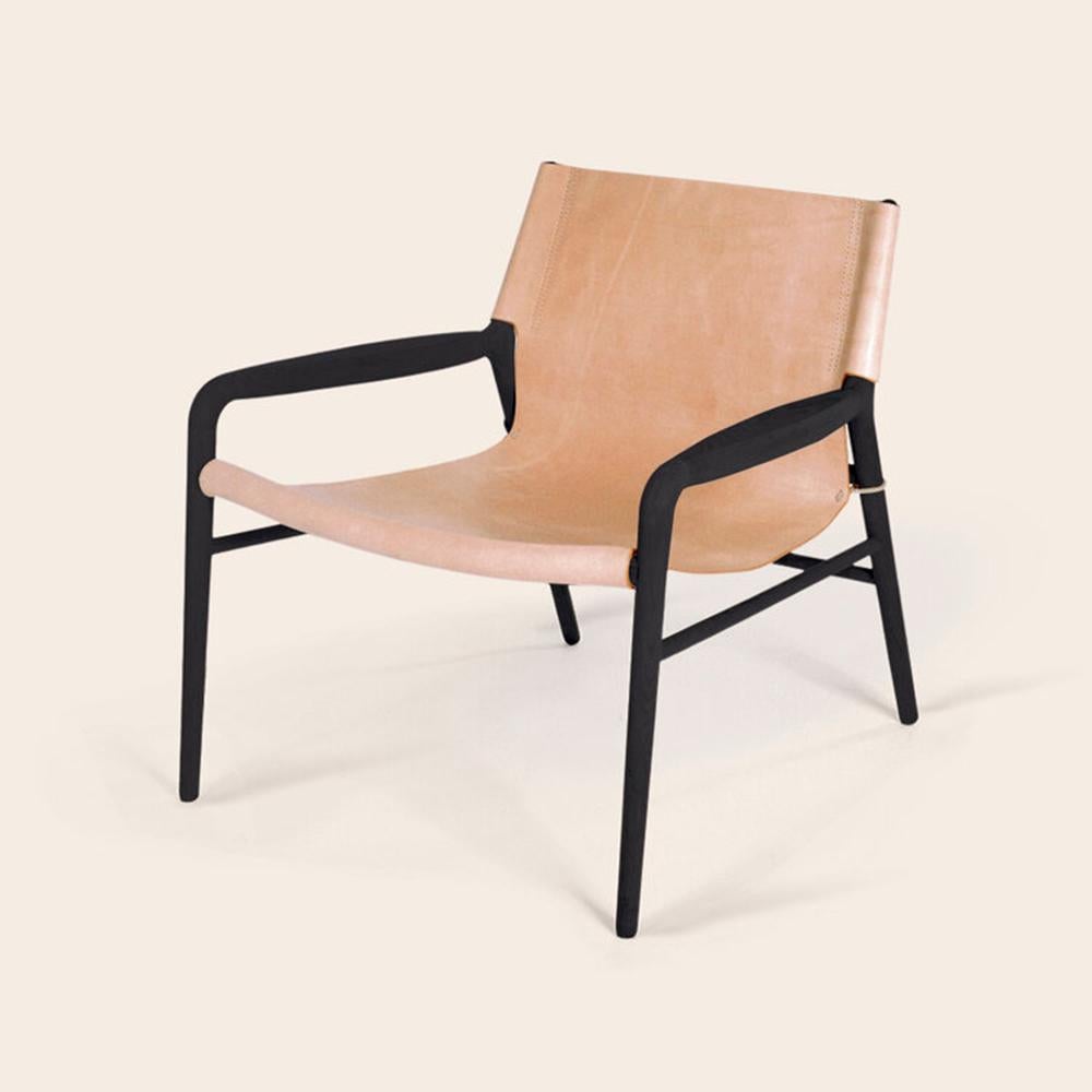 Nature and black rama oak chair by Ox Denmarq
Dimensions: D 72 x W 68 x H 70 cm
Materials: Leather, wood
Also available: Different colors available

OX DENMARQ is a Danish design brand aspiring to make beautiful handmade furniture, accessories