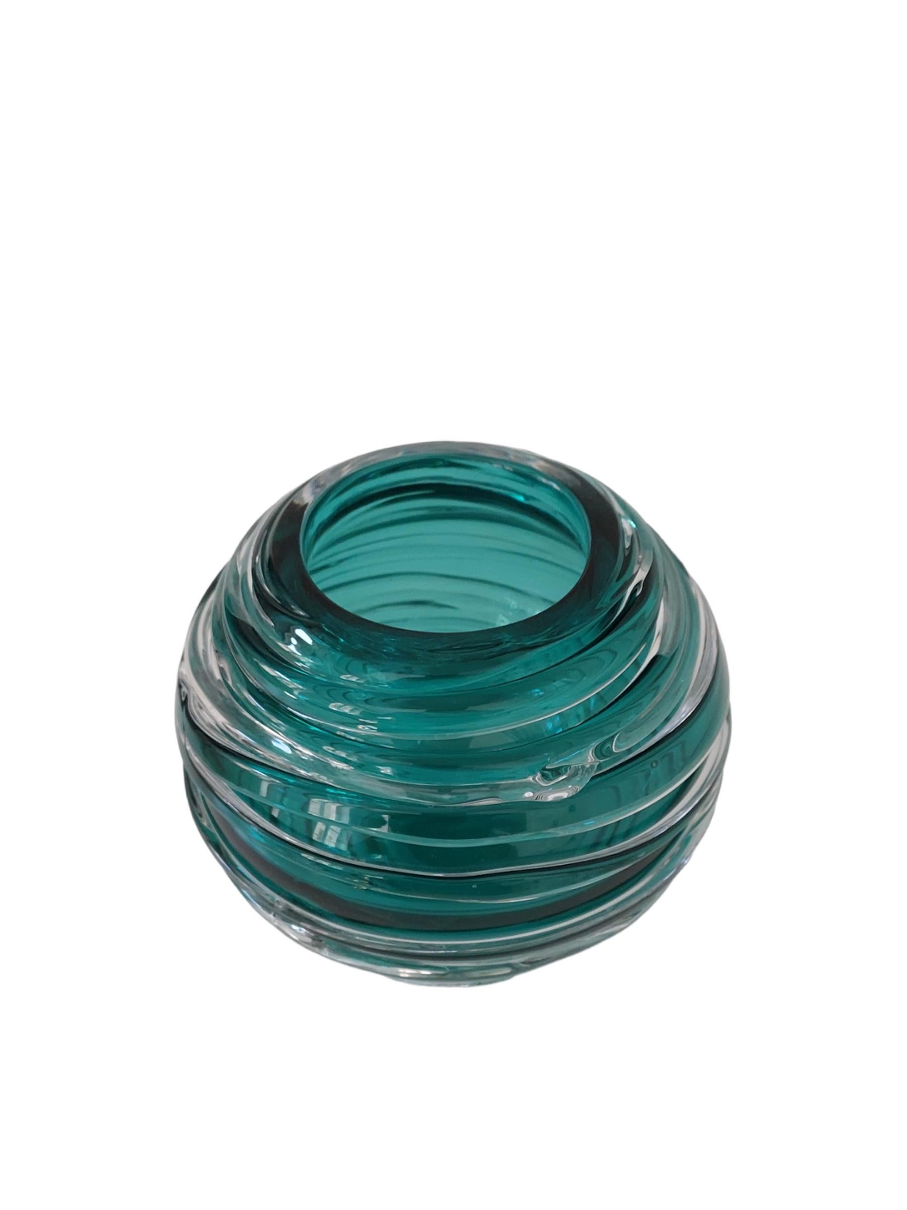 Mouth blown glass vase completely hand-crafted. Tourmaline color with ribbed details.
16 cm / 6 1/4' diameter perfect size for everyday flowers and even beautiful when empty as a sculpture that will enhance the exquisite design detail.
Mouth opening