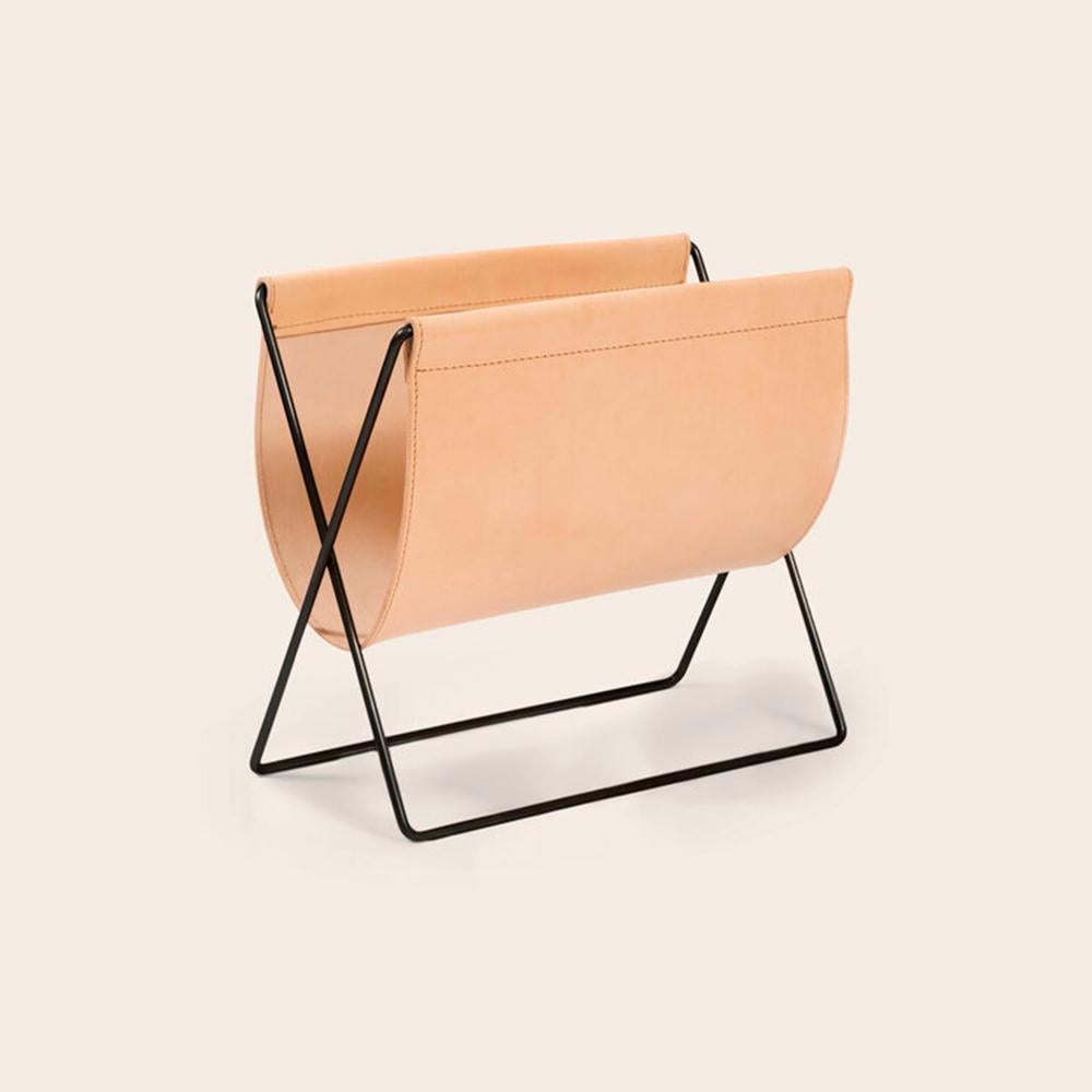 Nature leather and black steel maggiz magazine rack by Ox Denmarq
Dimensions: D 24 x W 47 x H 43 cm
Materials: steel, leather
Also available: different leather and frame colors available.

Ox Denmarq is a Danish design brand aspiring to make