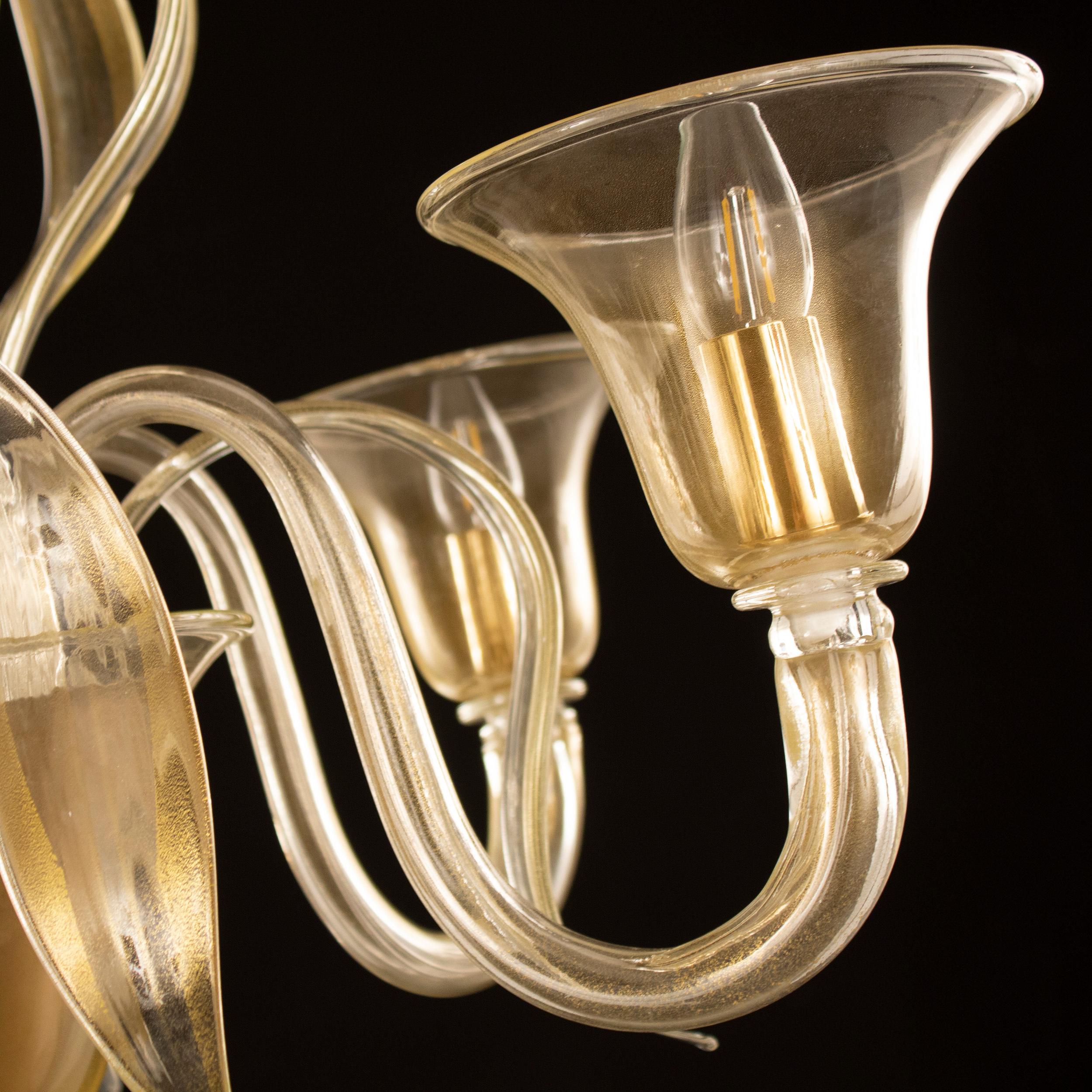 Swing 275 chandelier, 5 upwards lights, gold Murano glass by Multiforme. 
The collection of Murano glass chandeliers Swing 275 is one of our collections that most differs from the Classic Murano tradition: the design of this collection is closer to