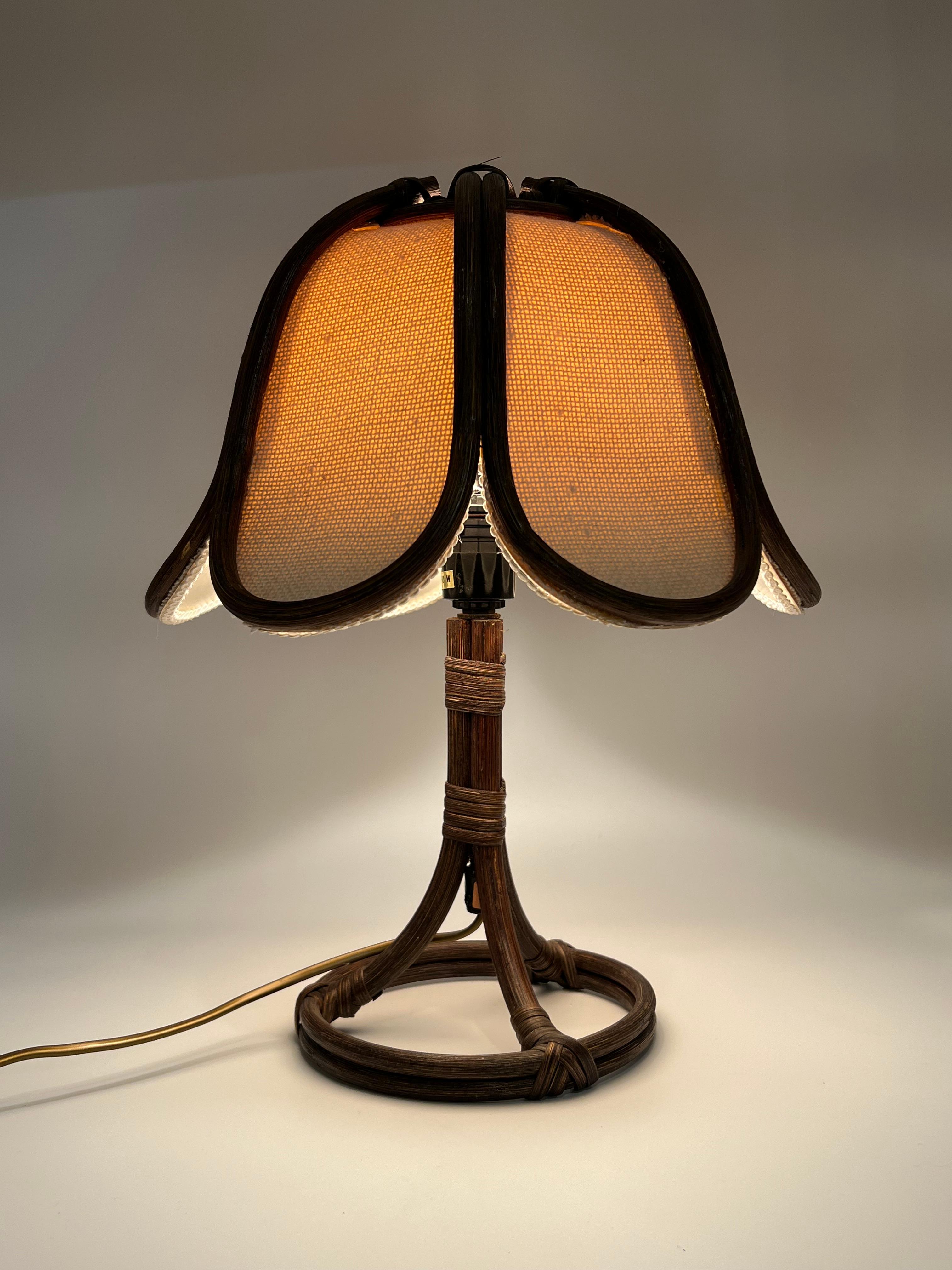 Vintage Scandinavian Mid-Century Modern Table Lamp, crafted from natural rattan with the original lampshade.

Charming and elegant design, showcasing exquisite craftsmanship. Designed and produced by Norwegian Mikkelsen & Sønner, Norway, circa