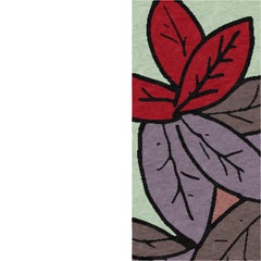 Nature‑inspired L‑shaped border rug with layered leaves. Hand‑knotted in Nepal.