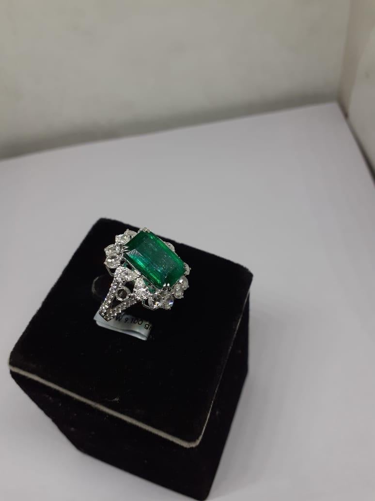 Diamonds : 2.35 carats
Emerald :  7.15 carats
Gold : 10.26  gm

Introducing our exquisite 18 Karat White Gold Ring featuring a stunning 7.15 carat natural Zambian Emerald and  2.35 carats of diamonds. This ring is truly remarkable, showcasing the