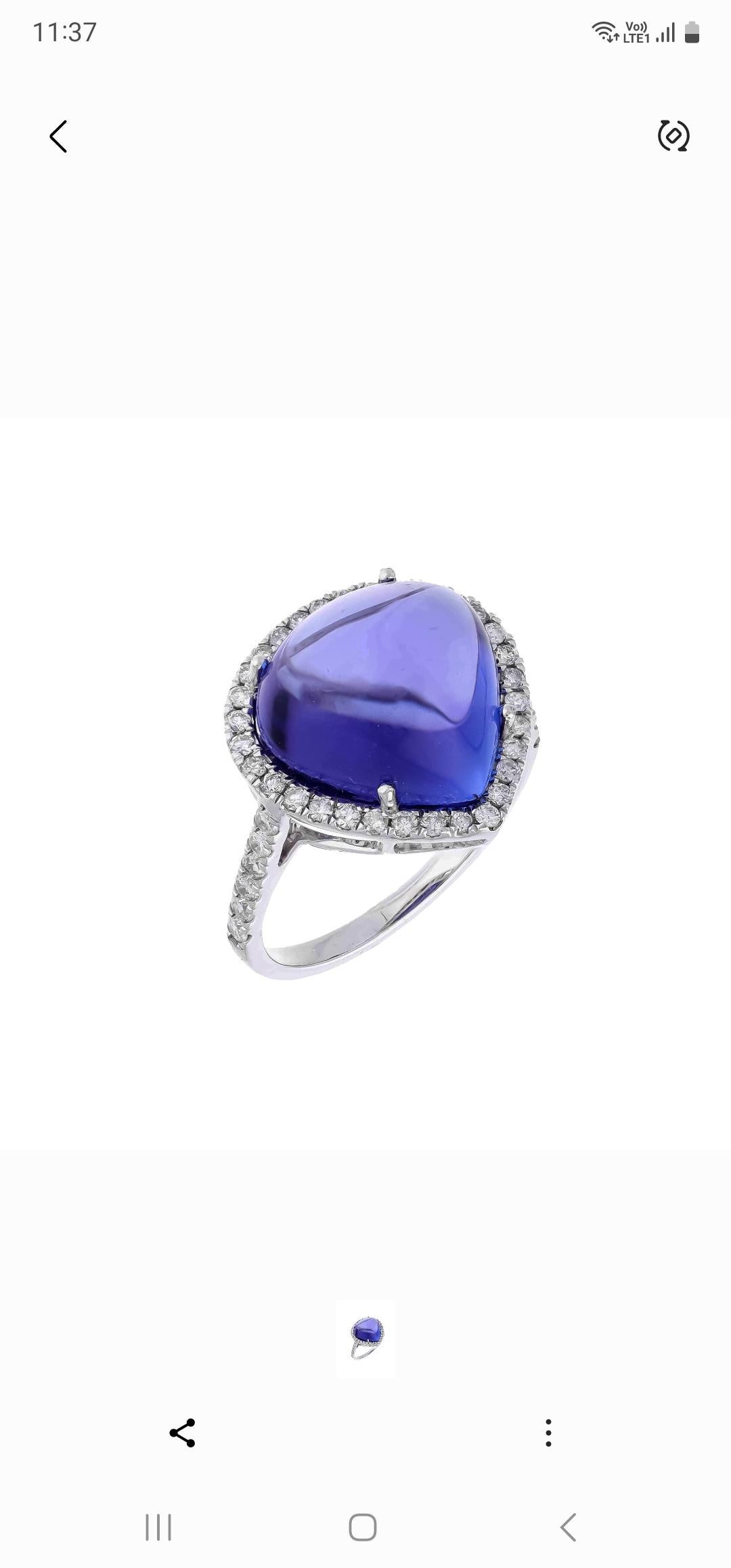 This extraordinary large Cabochon of 10.10 carat tanzanite is a true gemstone that is highly treasured. It is surrounded by a total of 0.40 carats of shimmering white diamonds, which adds to the overall beauty and elegance of the piece. The oval-cut