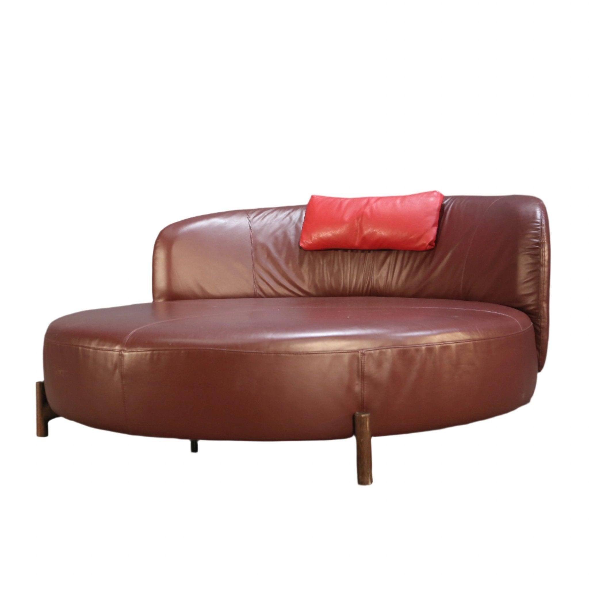 Elevate your living space with the Amalia Round Sofa by Natuzzi. This luxurious piece features a sleek and modern design, perfect for any contemporary home. Crafted with the finest materials, the Amalia sofa boasts a sturdy wooden frame and plush