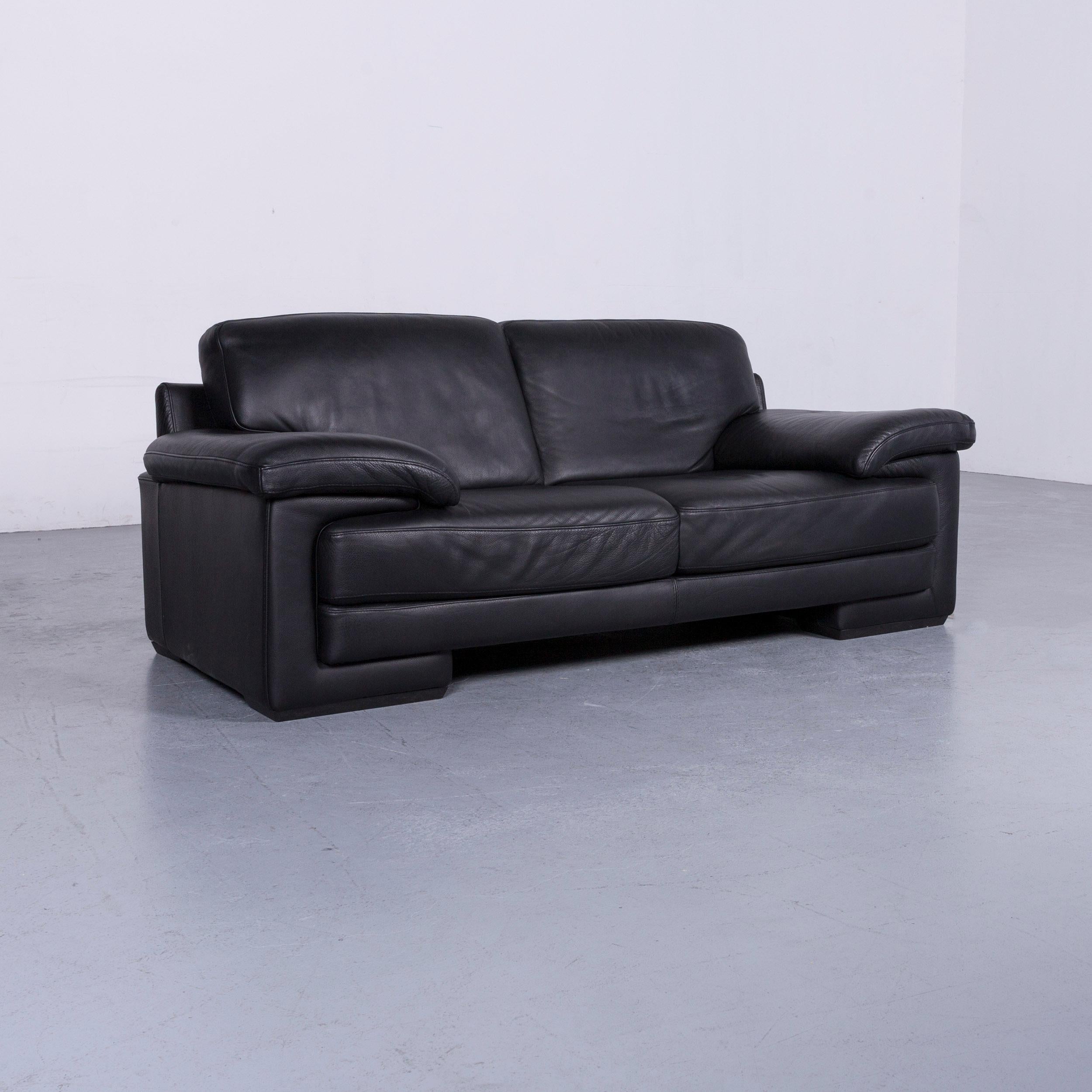 Natuzzi designer leather three-seat sofa couch in black.