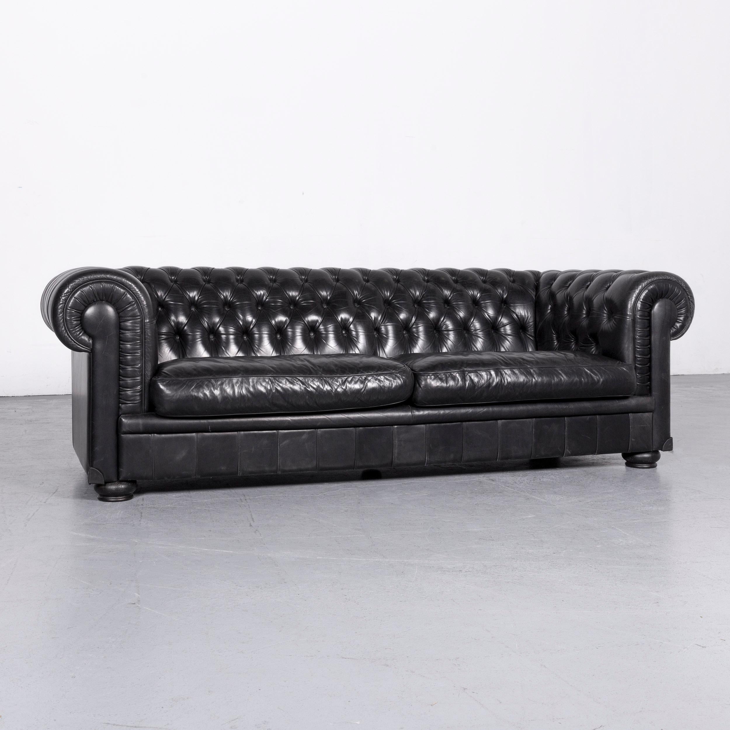 We bring to you a Natuzzi King designer leather sofa three-seat couch black in Chesterfield style.