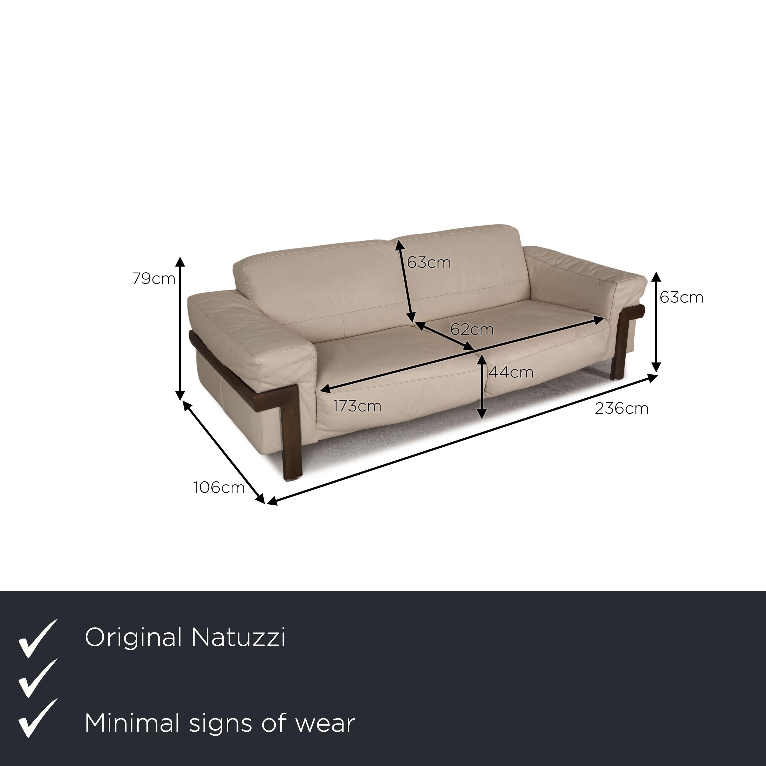 We present to you a Natuzzi leather sofa cream two-seater couch.

Product measurements in centimeters:

Measures: depth: 106
width: 236
height: 79
seat height: 44
rest height: 63
seat depth: 62
seat width: 173
back height: 63.

 