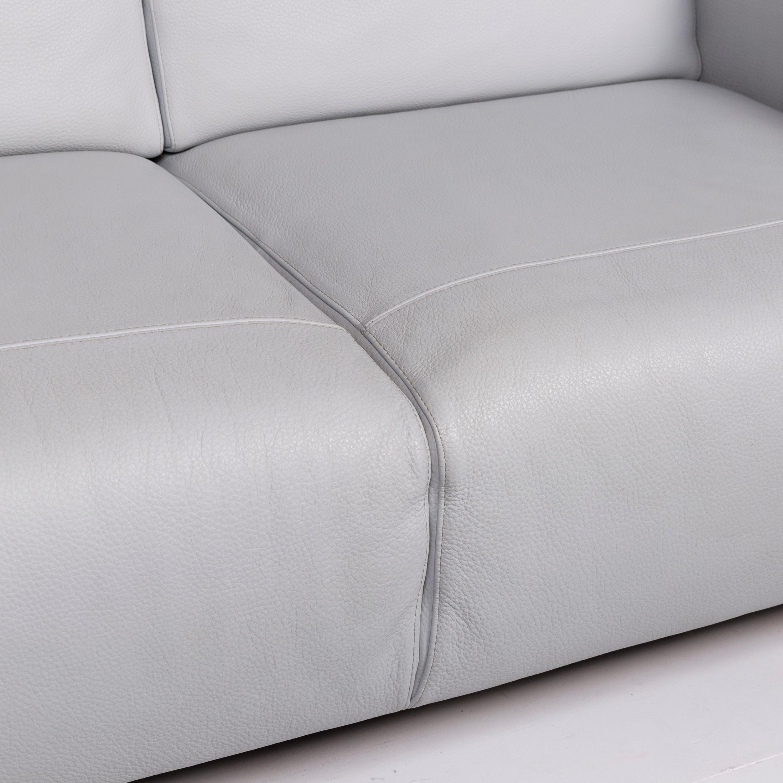 We bring to you a Natuzzi leather sofa ice blue gray blue two-seat couch.

 
Product measurements in centimeters:
 

Depth 96
Width 171
Height 79
Seat-height 43
Rest-height 64
Seat-depth 55
Seat-width 120
Back-height 35.
 
