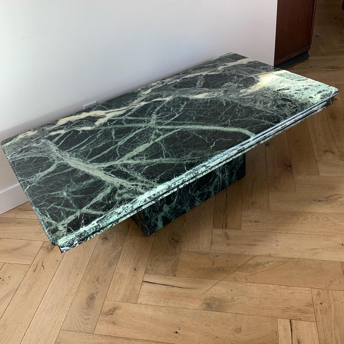 Vintage Italian pedestal marble coffee table by Natuzzi in deep phthalo green with sumptuous ivory and seafoam veining. Minor light scratches but no losses; overall fabulous  condition. Table is two pieces, which facilitates storage and transport.