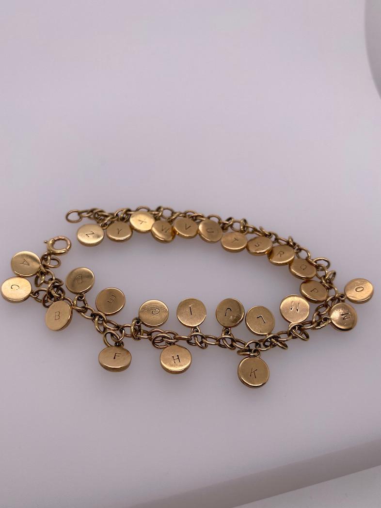 Nautical Alphabet Reverse Crystal Gold Bracelet In Excellent Condition In New York, NY