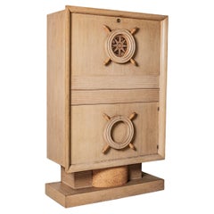 Used Nautical bar cabinet in oak in the style of Charles Dudouyt