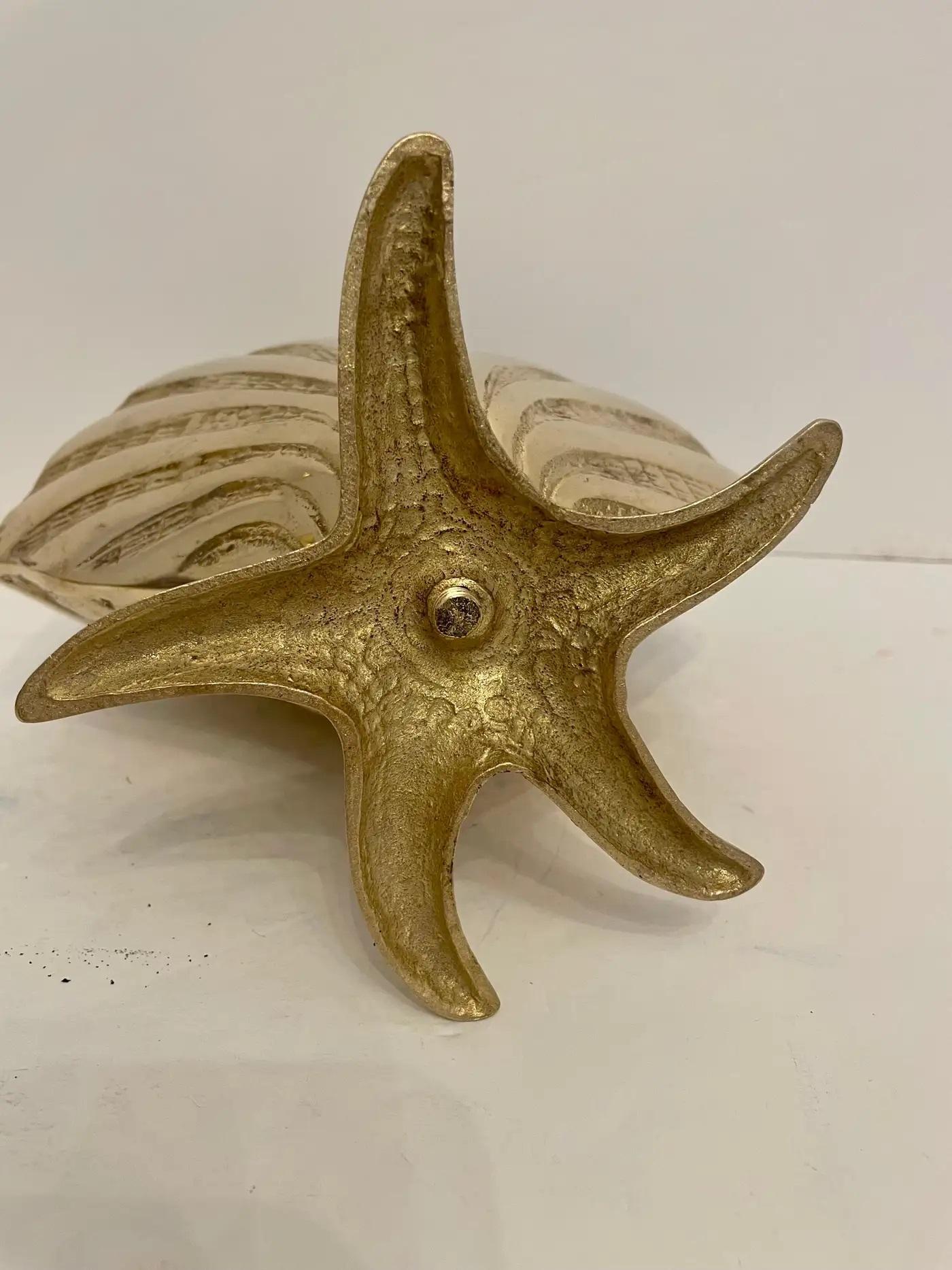 Large brass sea shell planter on starfish base. Very unusual design with nice detail. Nice hand polished finish. Overall nice condition. Ready for your beach house! QUICK SHIP, FREE in USA