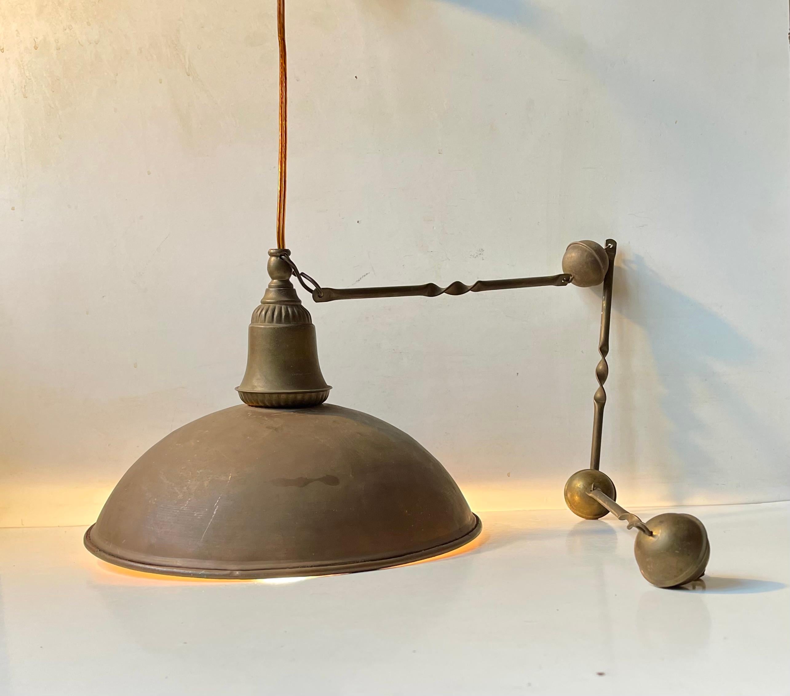 Its not just authentic looking it is authentic. A very patinated nautical ceiling pendant lamp composed of a solid copper shade, an ornamented solid brass top and an unusual ornamental chain also in solid brass. It was recently salvaged from a State