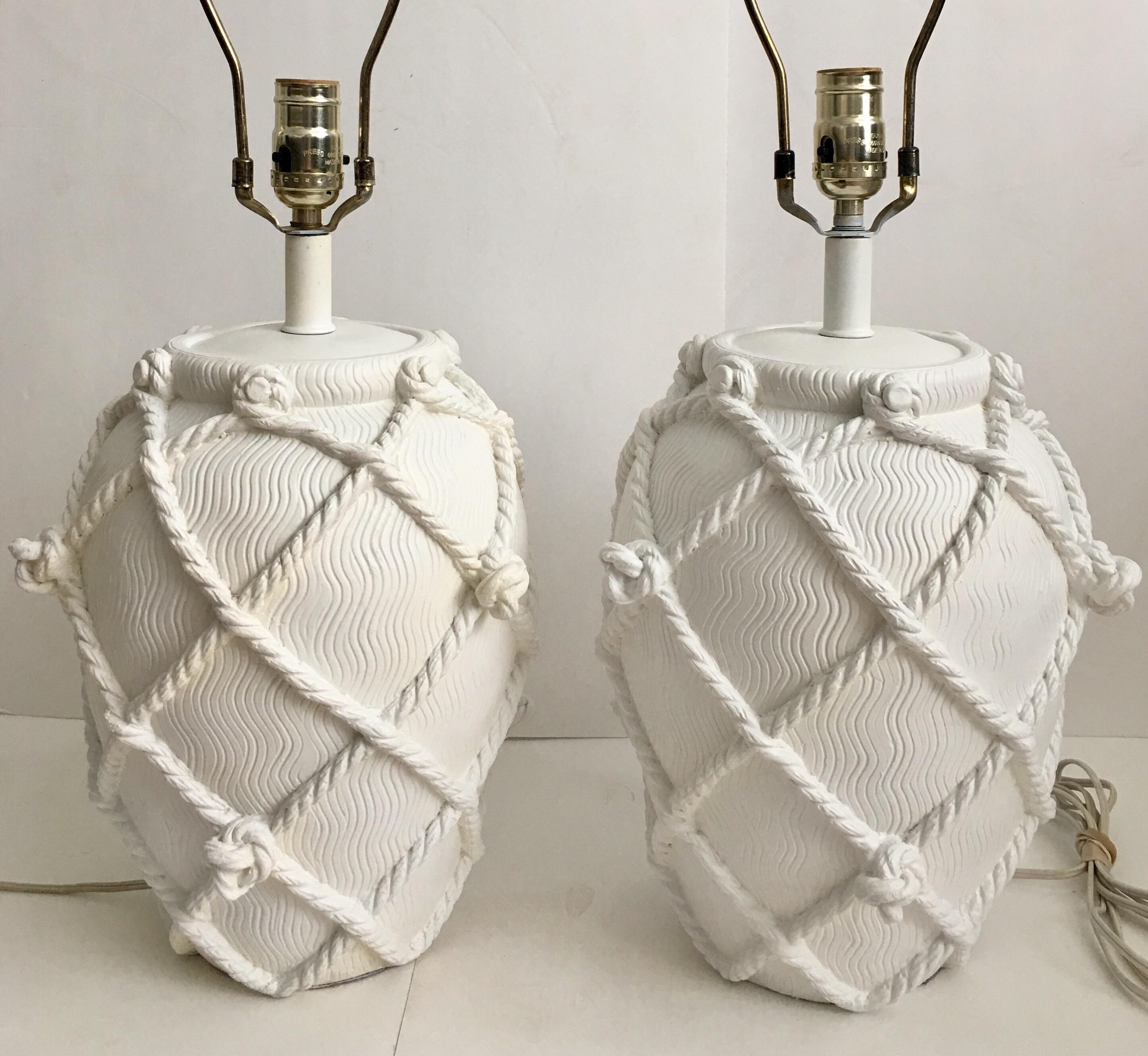 Pair of midcentury matte white ginger jar table lamps featuring a faux knotted rope design. 

25 inches high to finial.
18 inches high to socket.
