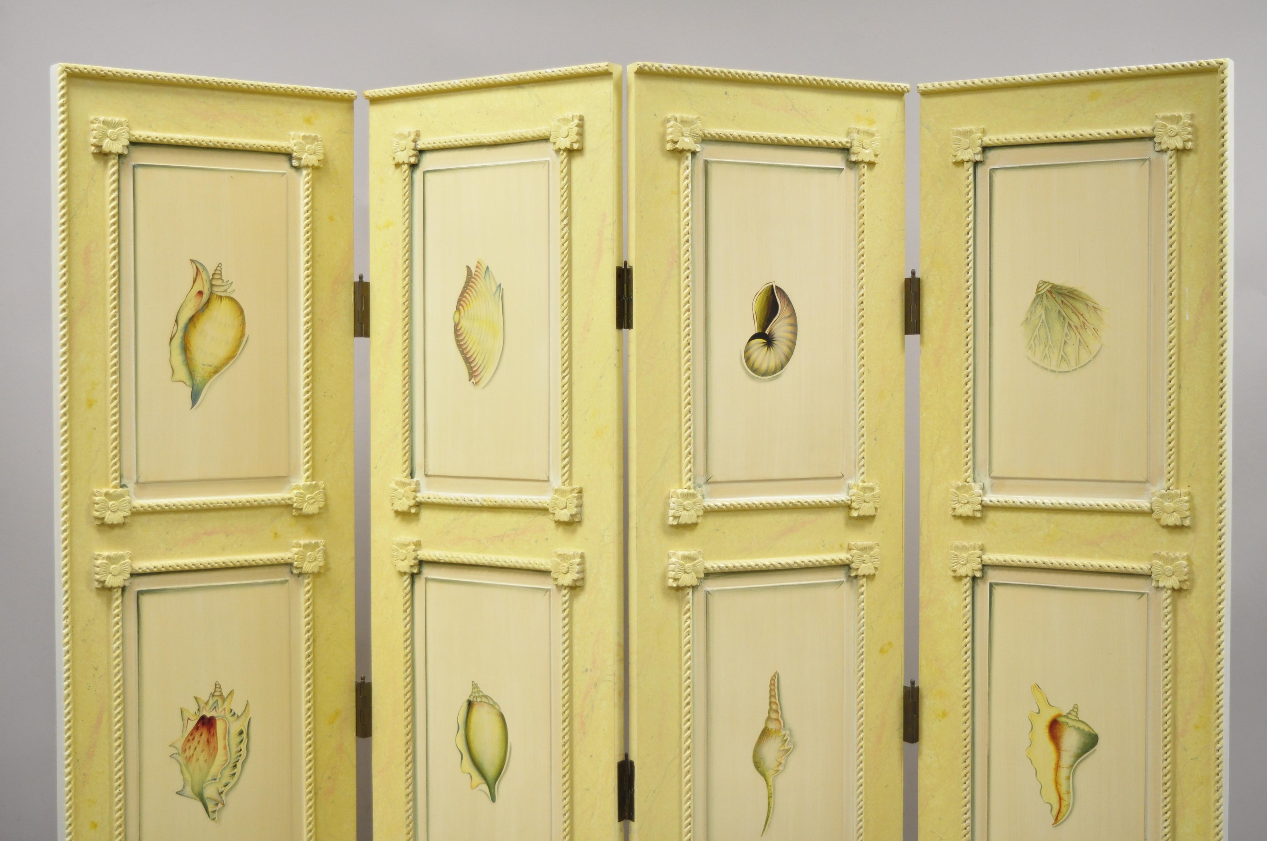Nautical four panel yellow painted folding screen room divider with painted conch seashells. Item features 4 panels, curved rope picture frame trim, painted conch seashell sections, painted on both sides, very nice vintage item, great style and