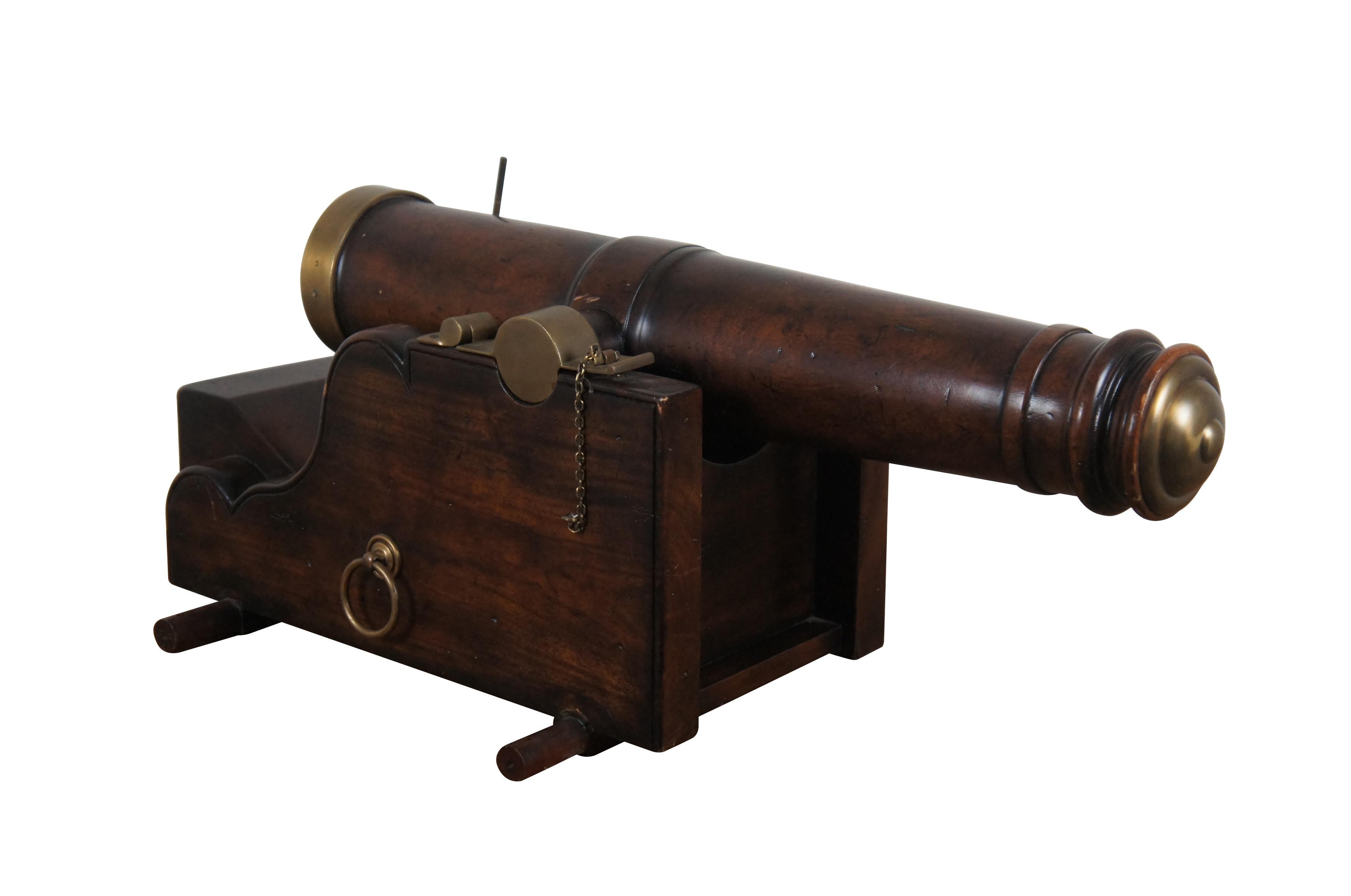 Large mahogany reprodution Nautical Maritime Naval cannon and base with brass accents, by Luxury Furniture, SE10109.

Dimensions:
30