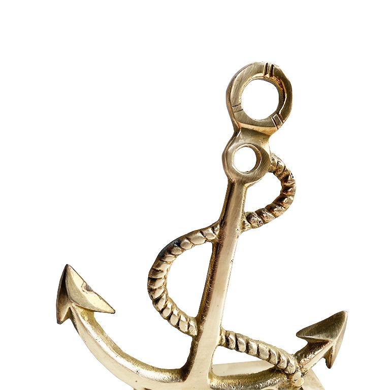 Anchors away! Add a touch of nautical style to your study. This lovely brass bookend features a brass anchor with a faux brass rope tied at its top. The anchor sits slightly off-kilter giving it a whimsical look. If needed, (we aren't exactly sure