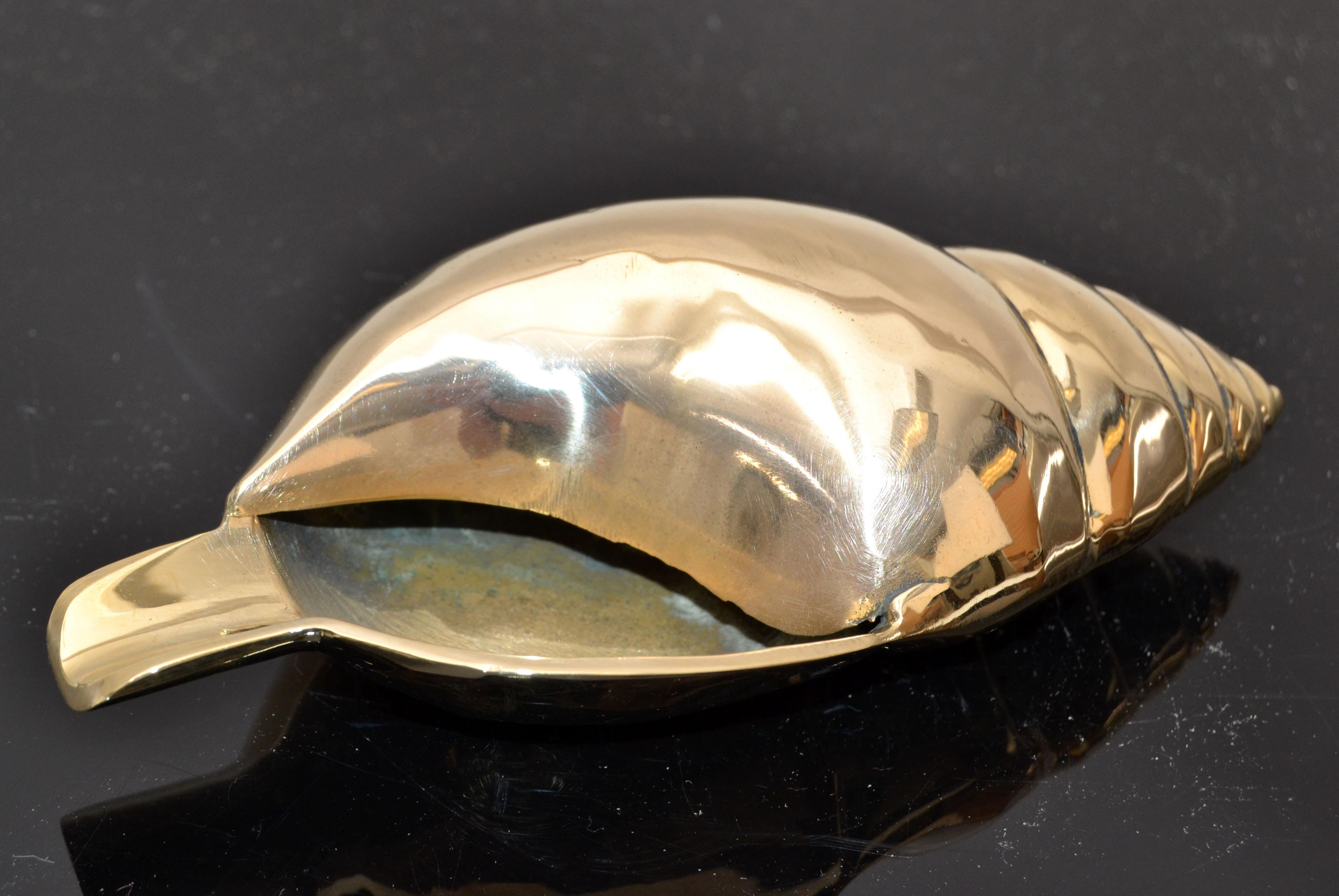 Mid-Century Modern Nautical polished brass ashtray seashell sculpture.
Coastal Tabacco Accessories all handmade.
 