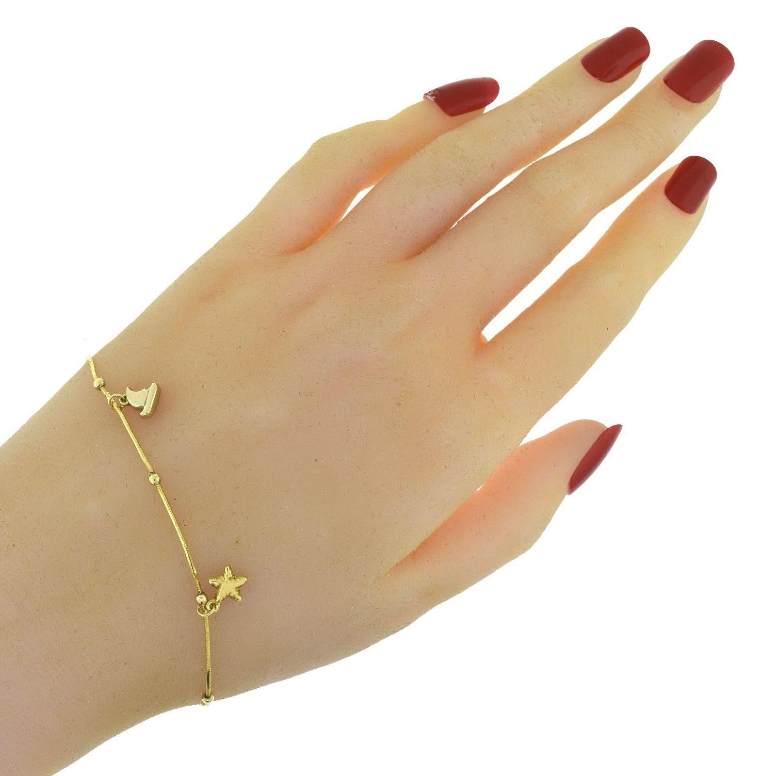 Nautical Shark Fin, Fish, and Starfish Yellow Gold Charm Bracelet In Good Condition In Miami, FL