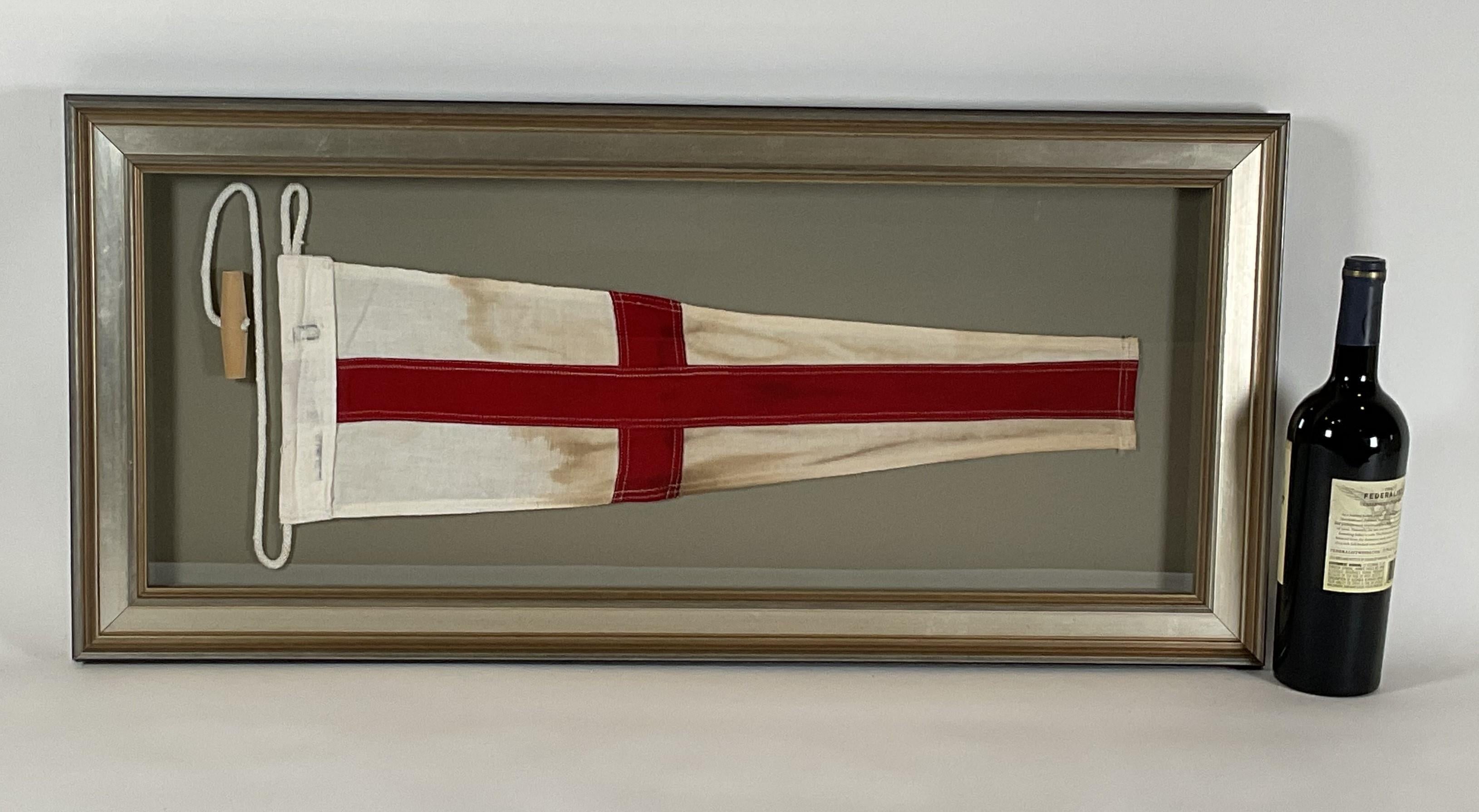 eight. The flag has a sturdy canvas hoist that is fitted with a white rope and wood toggle. The linen field is a panel of white with red bands. Fitted to a custom shadowbox frame with a silver grey moulding. 

Weight: 8 lbs.
Overall Dimensions: