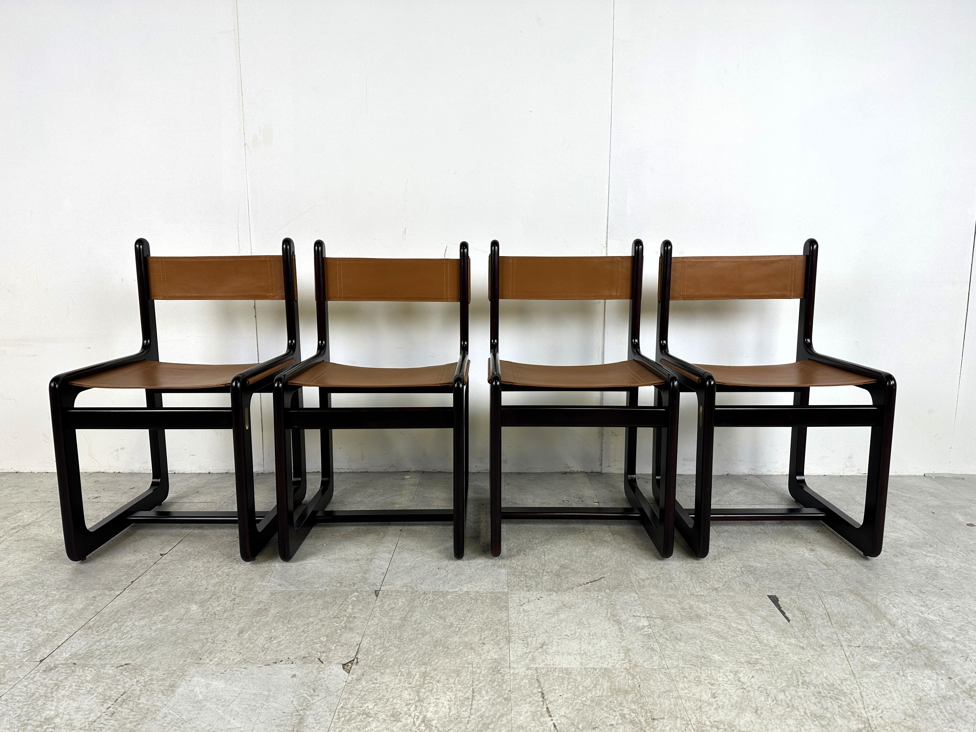 Mid century Nautical style dining chairs designed by Gigi Radice and Pierangelo Gallotti.

The chairs have a beautiful rosewood frame with brass details and sling leather seats and backrests.

Very good condition. 

Dimensions:
Height: