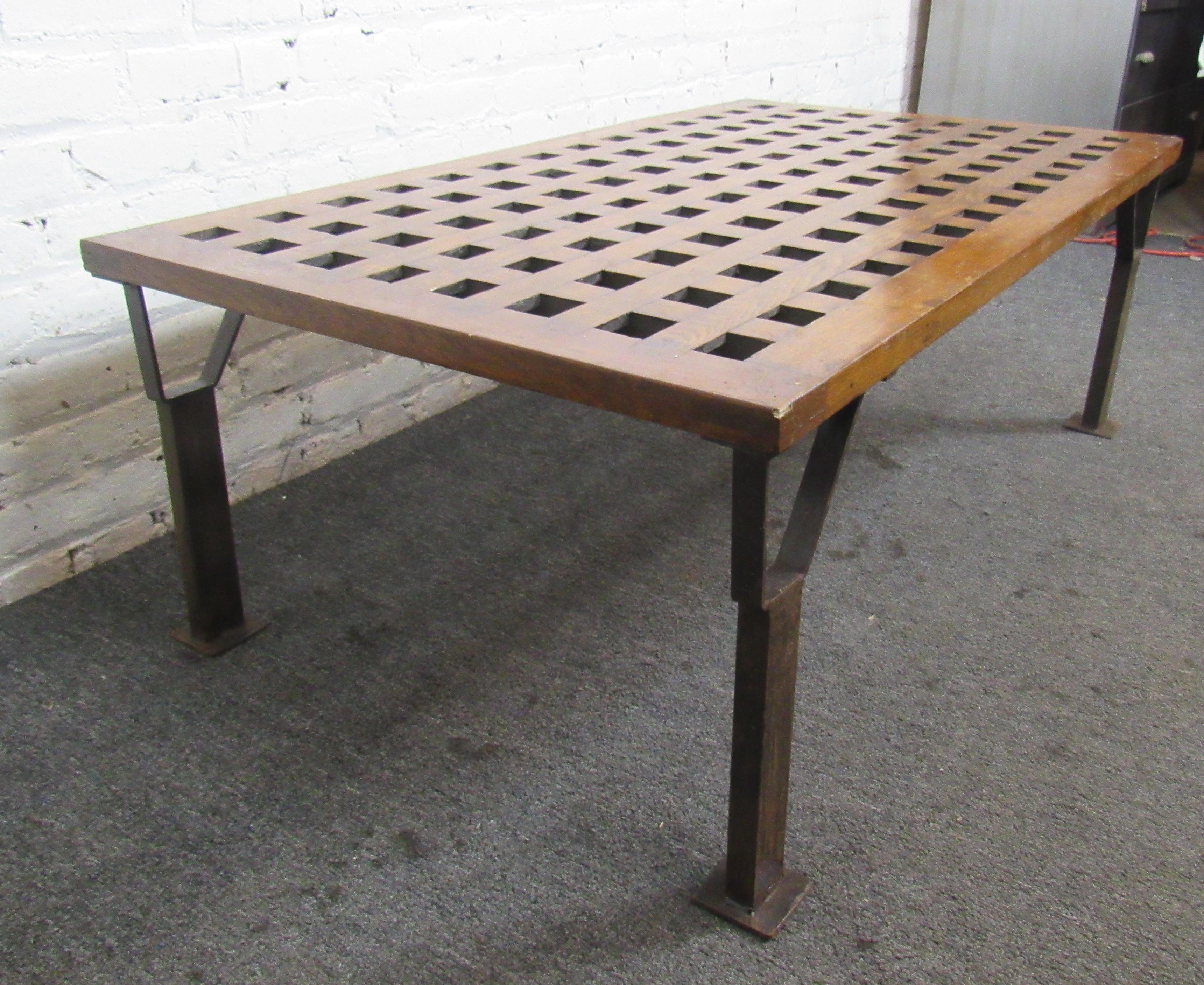Long coffee table with grid top and iron leg base.
Location: Brooklyn NY.