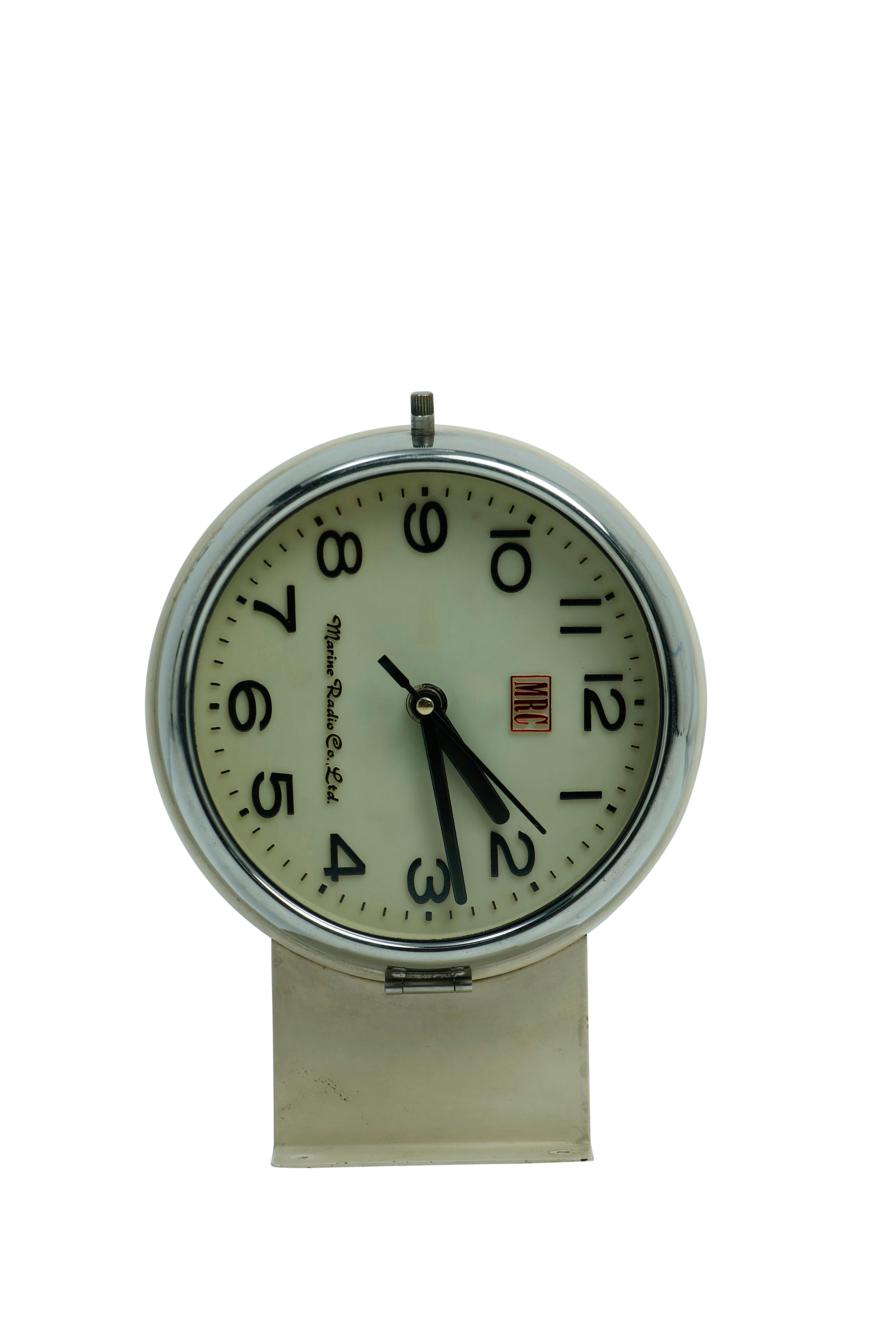 From a decommissioned ship, a very cool, double-sided beige and chrome clock by Marine Radio Co. Ltd.  This would have been used in the hallway of a large ship and connected to all the others on the ship.  This one has had a battery conversion. 