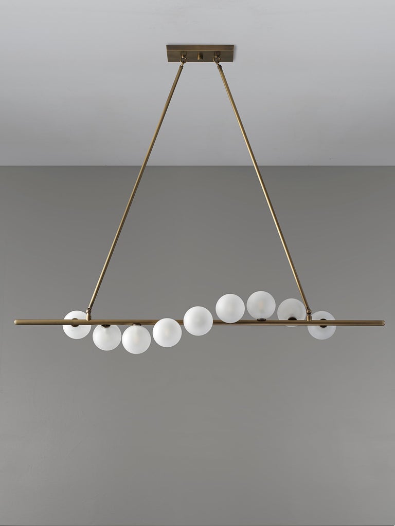 NAUTILUS chandelier by blueprint lighting is an elegant piece of functional sculpture that emits a stunning candlelit glow. Featuring gracefully spiraling satin glass globes, Nautilus is an elegantly striking centerpiece. Gorgeous from any