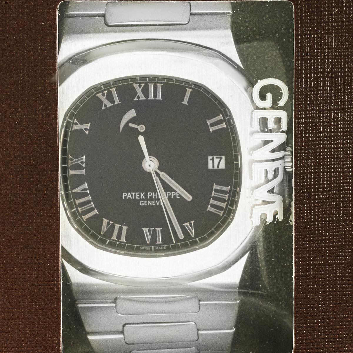 An extremely sought after men's Nautilus wristwatch in stainless steel by Patek Philippe, which is still service sealed. Features a black dial with applied roman numerals, a date aperture at 3 'clock and a rare unique comet tail which indicates the