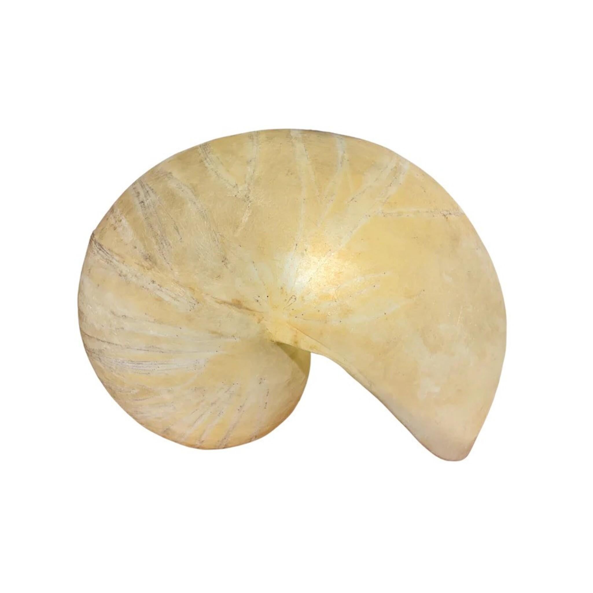This rare sculptural lamp by Italian artist and designer Marika Carniti Bollea is a coveted piece from her limited body of work. Shaped in the form of a nautilus shell, the design evokes a quiet sense of movement and balance. Marika Carniti Bollea