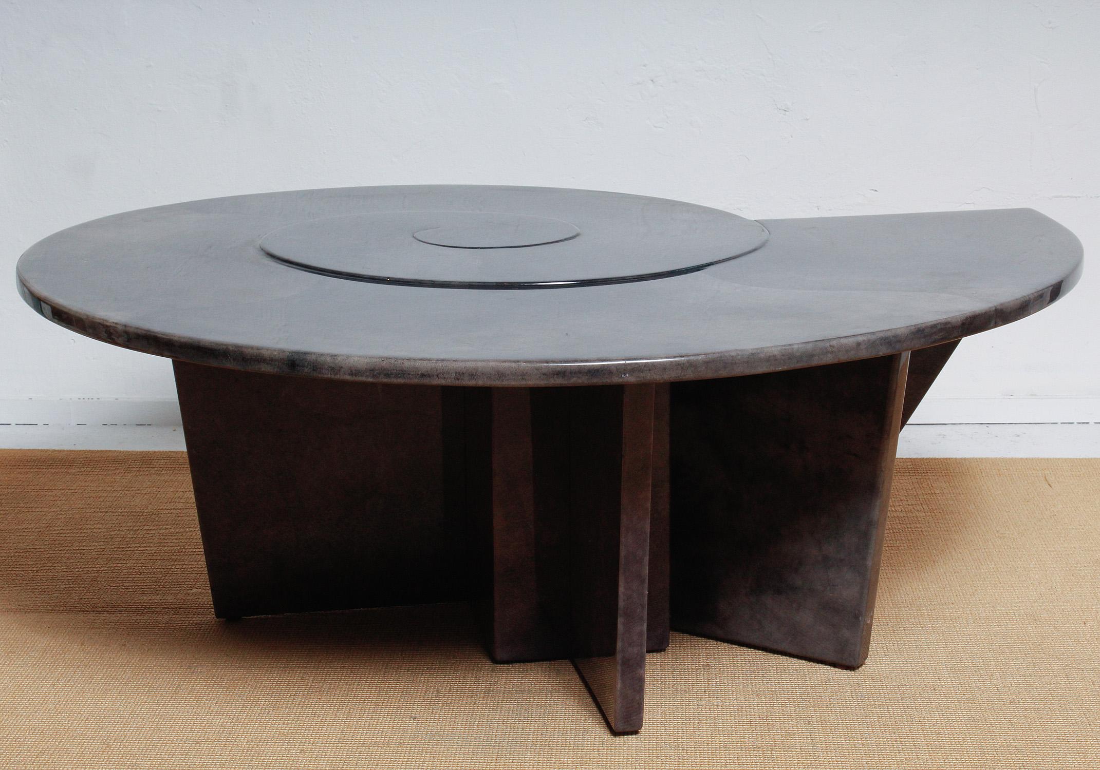 A nautilus shell-shaped coffee table executed in gorgeous shades of charcoal grey goatskin, circa 1980. Nautical chic!