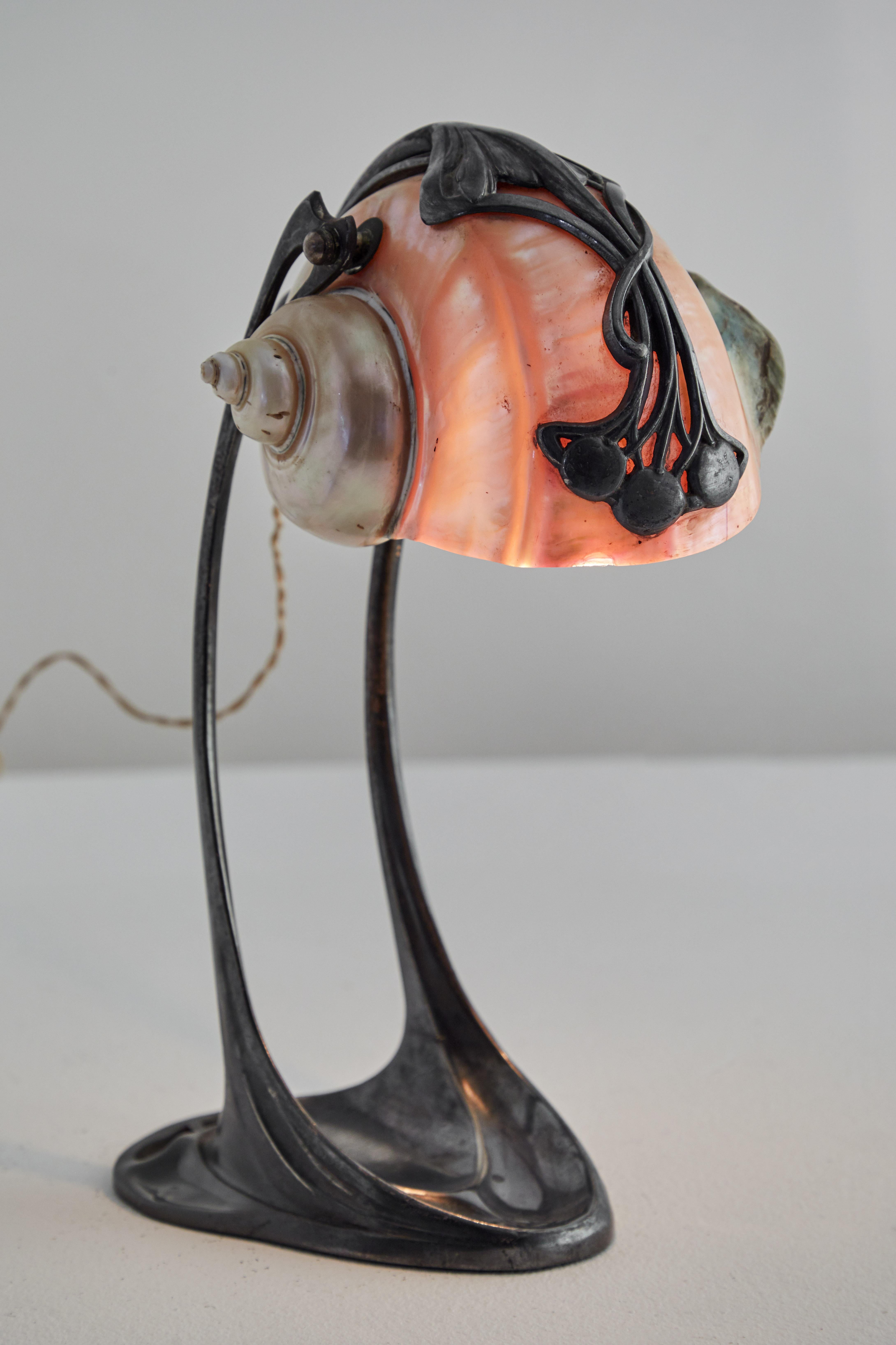Nautilus Table Lamp by Moritz Hacker.Designed and manufactured in the Austria, early 1900's. Original cord. Natural shell and pewter. Retains original manufacturers stamp MH20. Takes one e27 75w maximum bulb. Bulbs provided as a one time courtesy.