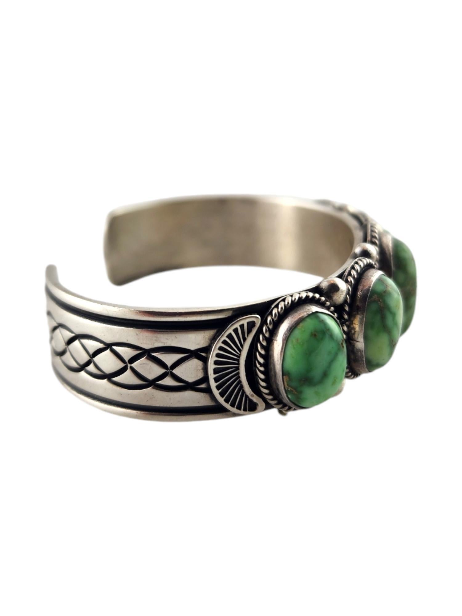 Navajo Albert Jake Sterling Silver Turquoise Cuff Bracelet

This gorgeous cuff bracelet by Navajo Albert Jake was meticulously crafted from sterling silver and is decorated with 5 stunning turquoise stones!

Approximate measurements-
5 1/4