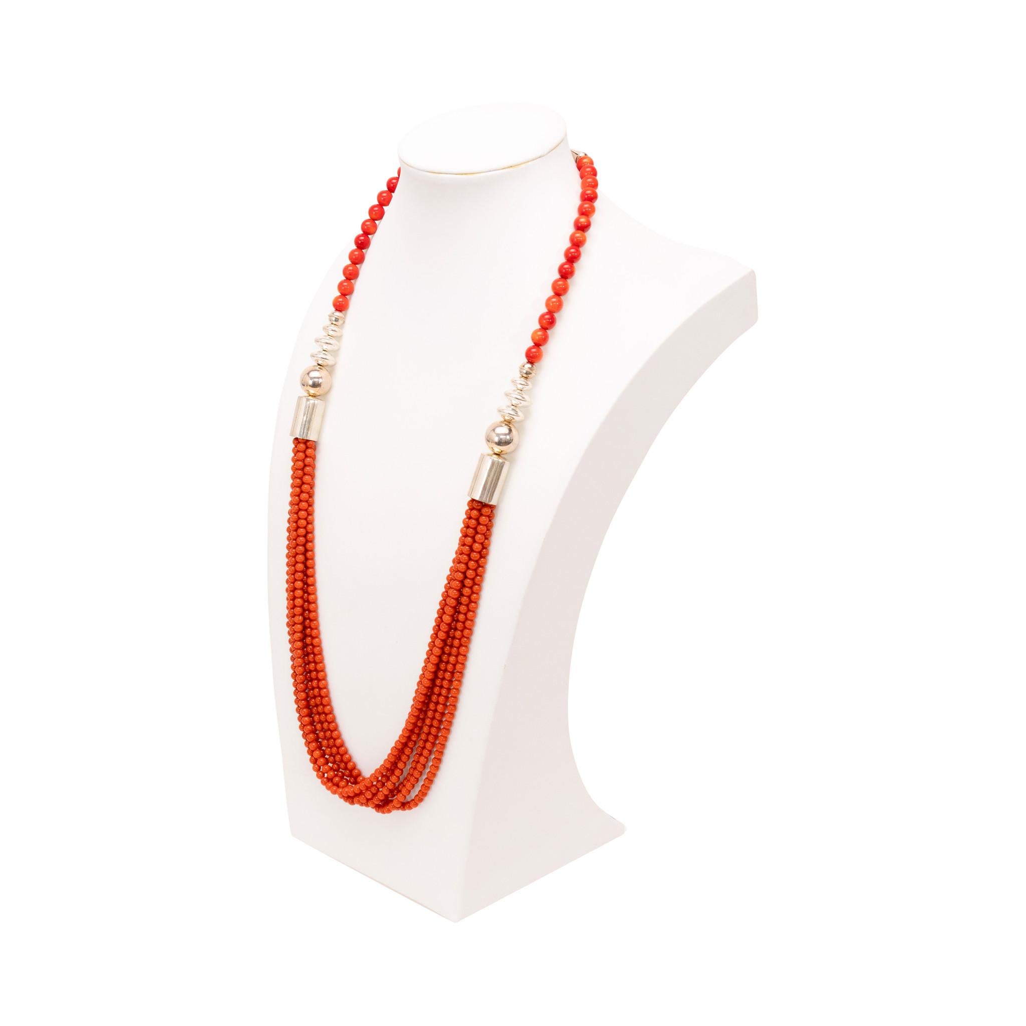 Native American Navajo Indian coral necklace by Doreen Lebya, Navajo. Coral bead necklace with graduated beads getting larger at the sterling barrel bead. The beads are all round and uniform. The 6 strands are the same length and lay intertwined.
