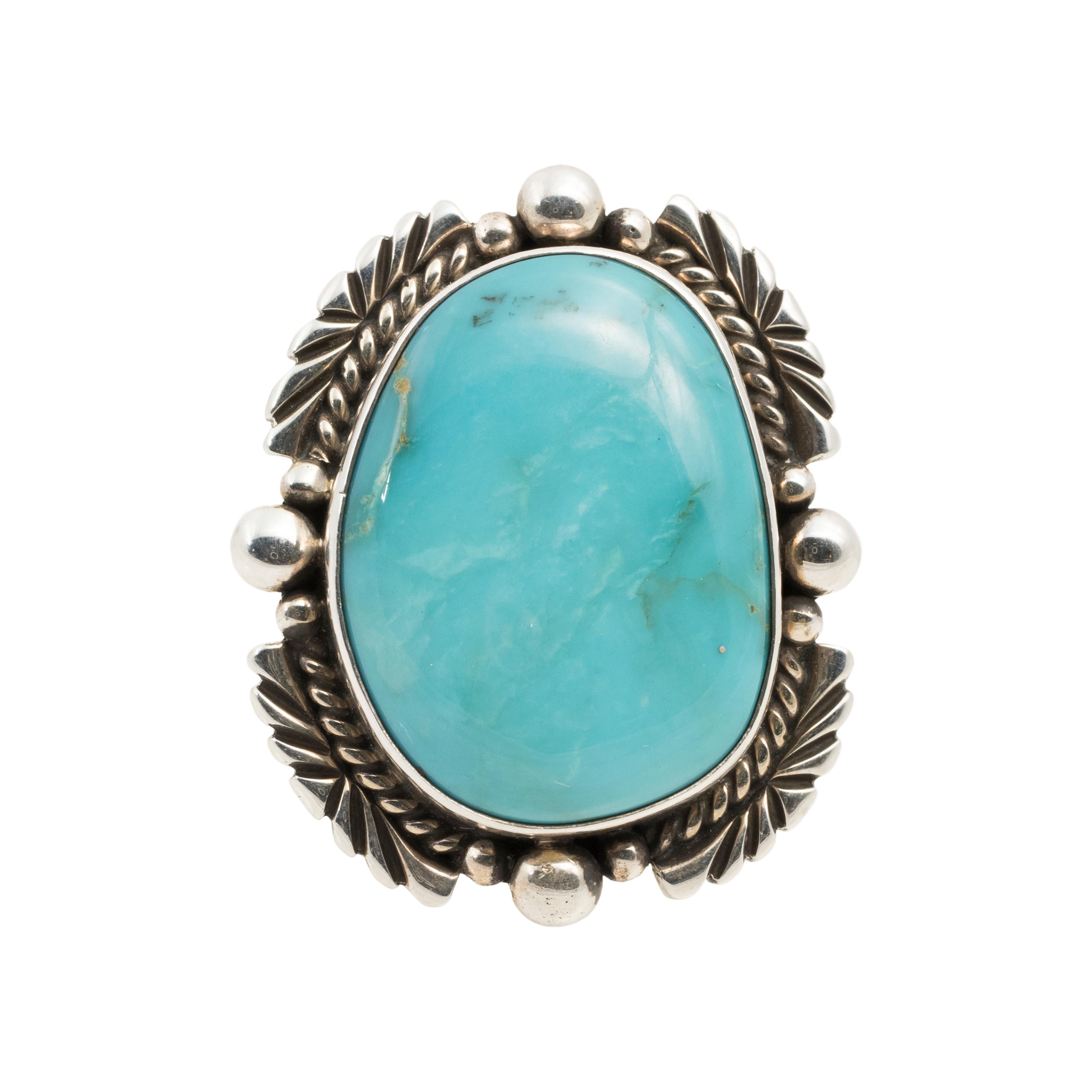 Navajo Blue Diamond turquoise ring. Large beautiful stone surrounded by classic twisted rope, palmette and bead border. Stamped 