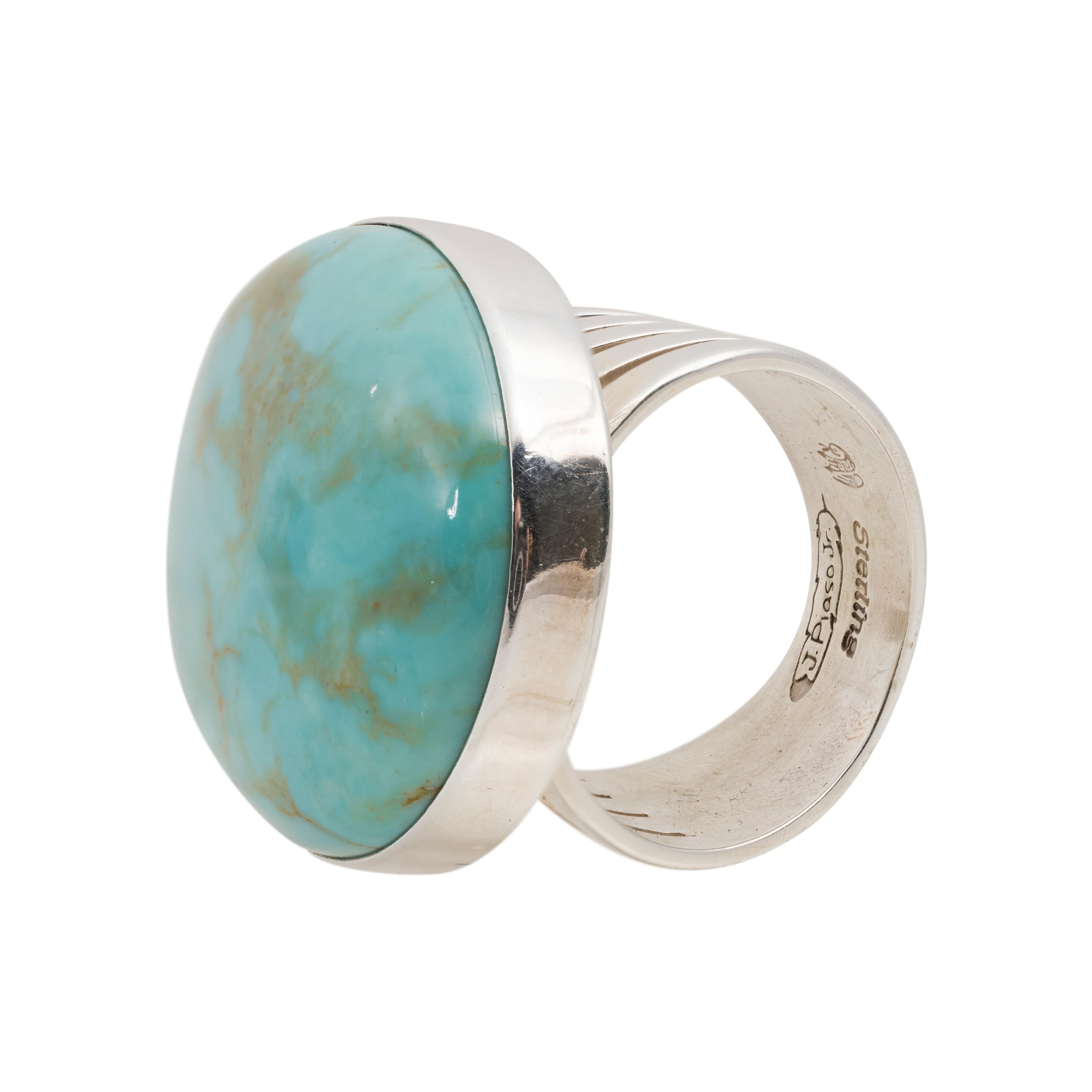Navajo Carlin turquoise and sterling ring. Beautiful stone set in sterling silver, wide band with slash marks on sides.  Stamped 
