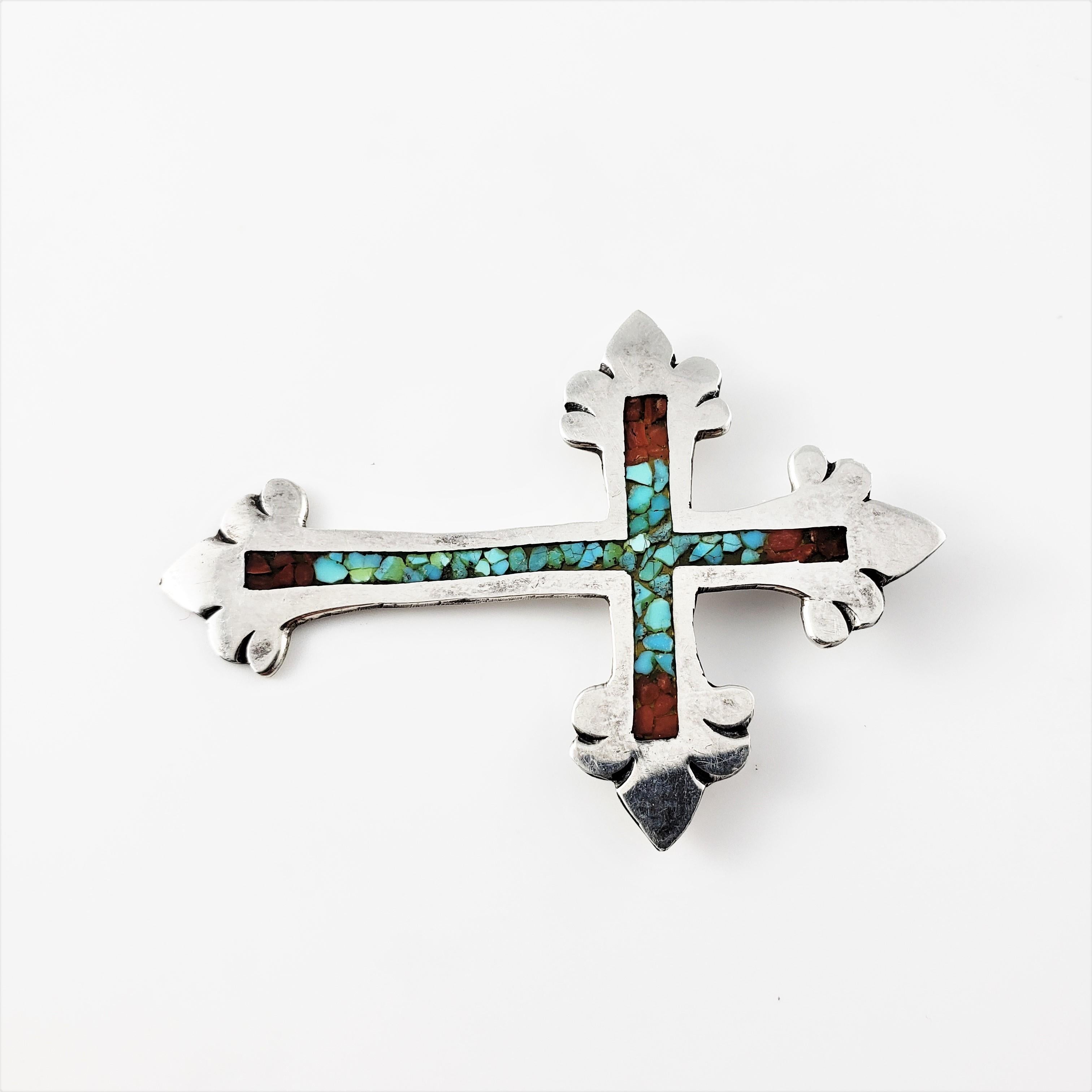 Vintage Navajo Charlie Singer Crushed Turquoise and Coral Silver Cross Pendant-

This cross pendant is decorated with crushed turquoise and coral set in beautifully detailed silver.

Size: 2.4 inches x 1.7 inches

Bale opening: 3 mm

Weight: 4.1