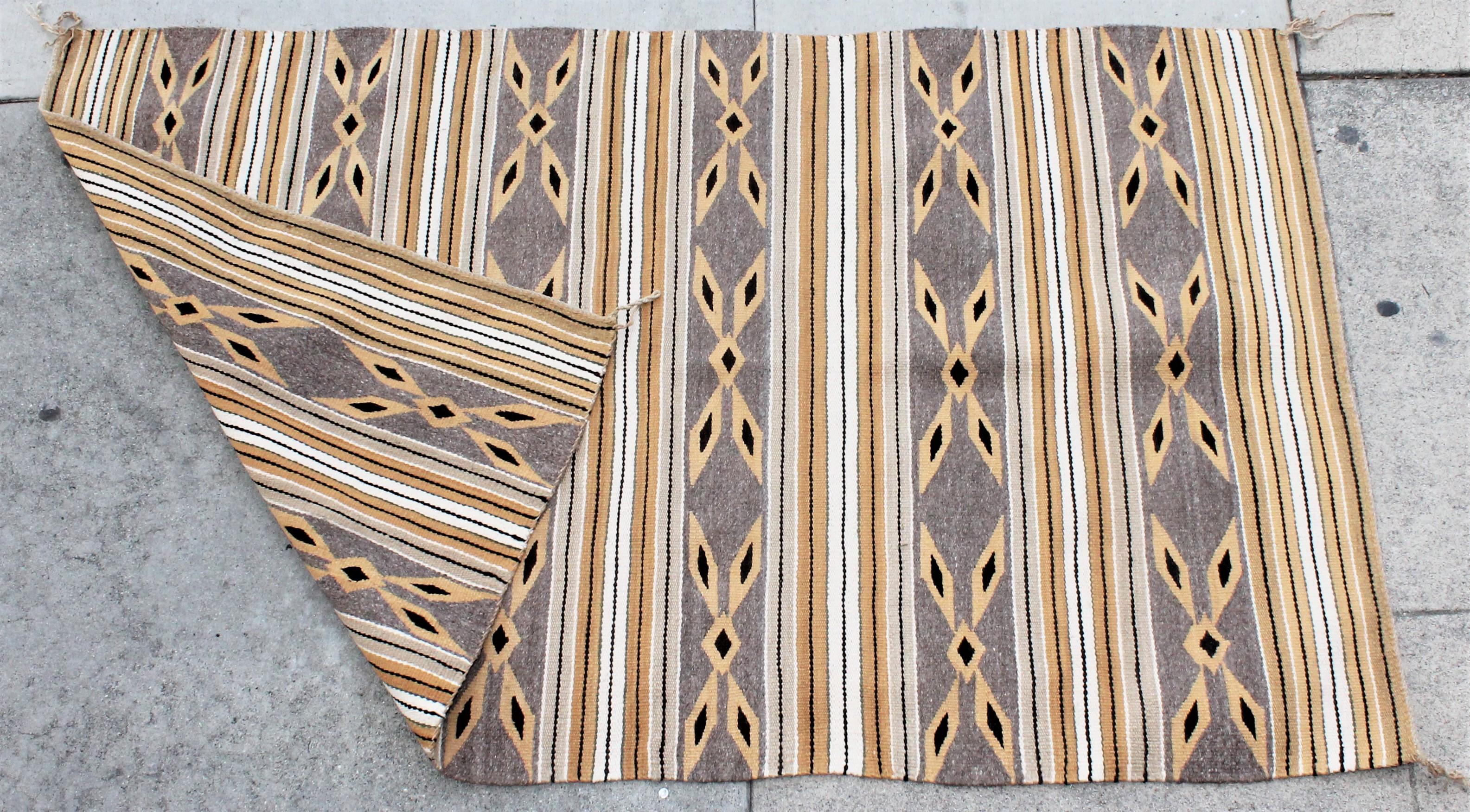 This fine golden rod and grey simple geometric weaving is in fine condition.