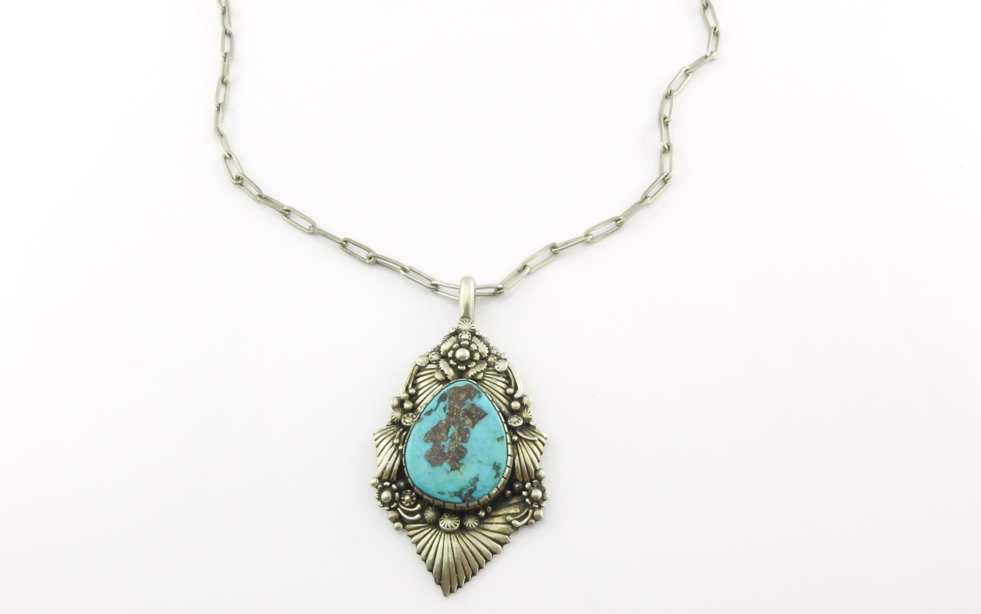 Clem Nalwood Navajo silver and turquoise pendant necklace.

Marked: NALWOOD.

Pendant Measures 3 1/4
