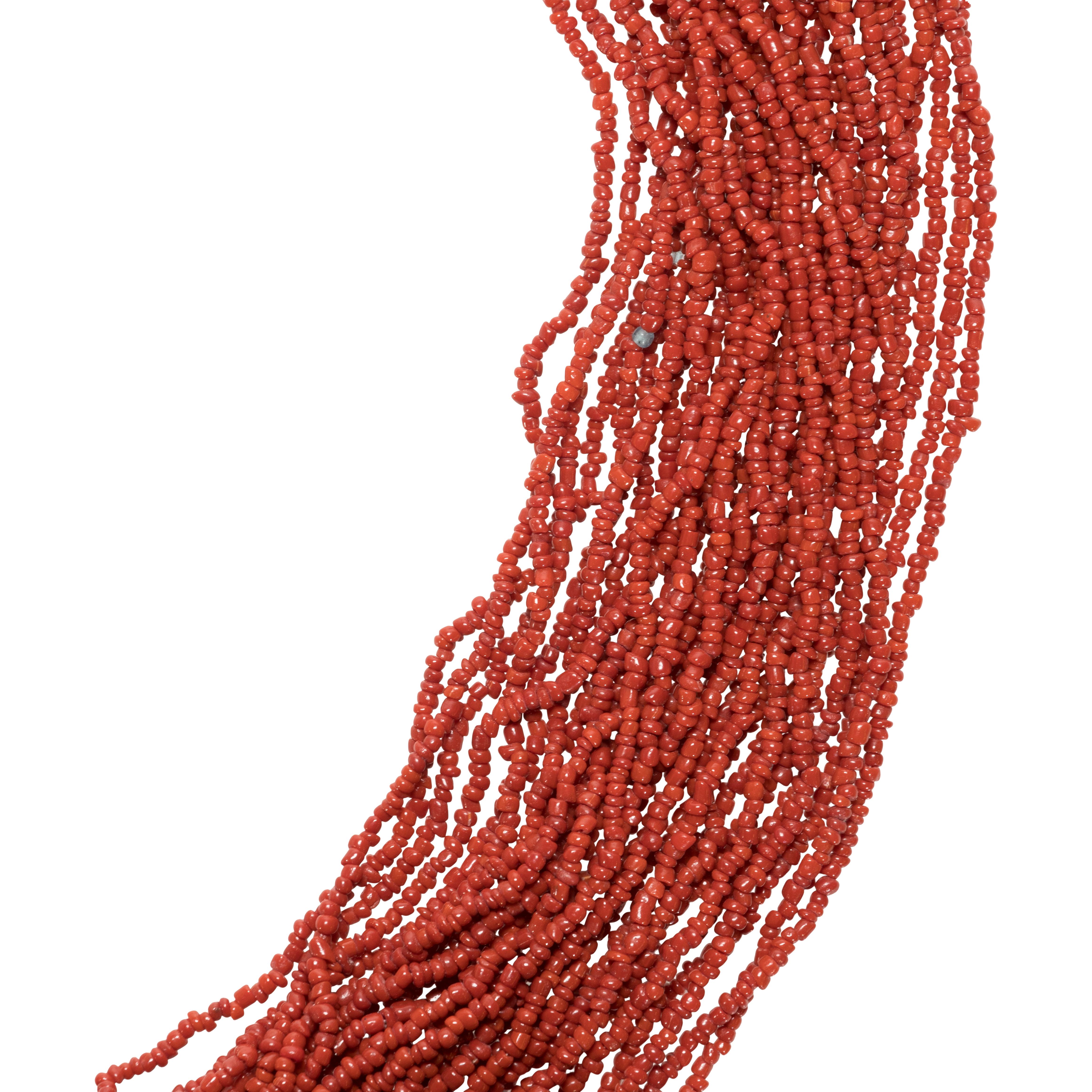 Zuni multi strand red coral seed bead necklace. Features 30 strands of oxblood colored coral, seed beads and a sterling silver hook and eye clasp.

PERIOD: Contemporary

ORIGIN: Southwest - Zuni, Native American

SIZE: 244 grams; 26