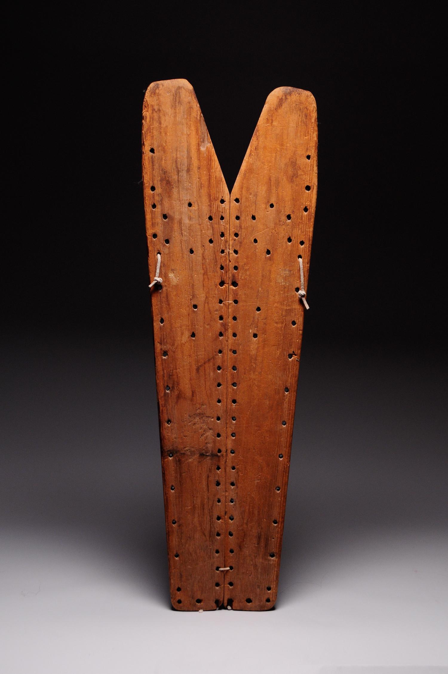 Region/Tribe: Southwest Arizona / Navajo

circa late 19th-early 20th century

Material: Commercial pine boards (2 pcs), ¾” wide drill holes

Dimension: L 31 ¾” x W 10 ½”.

Condition: Excellent, use wear, well rounded along edges, soiling and