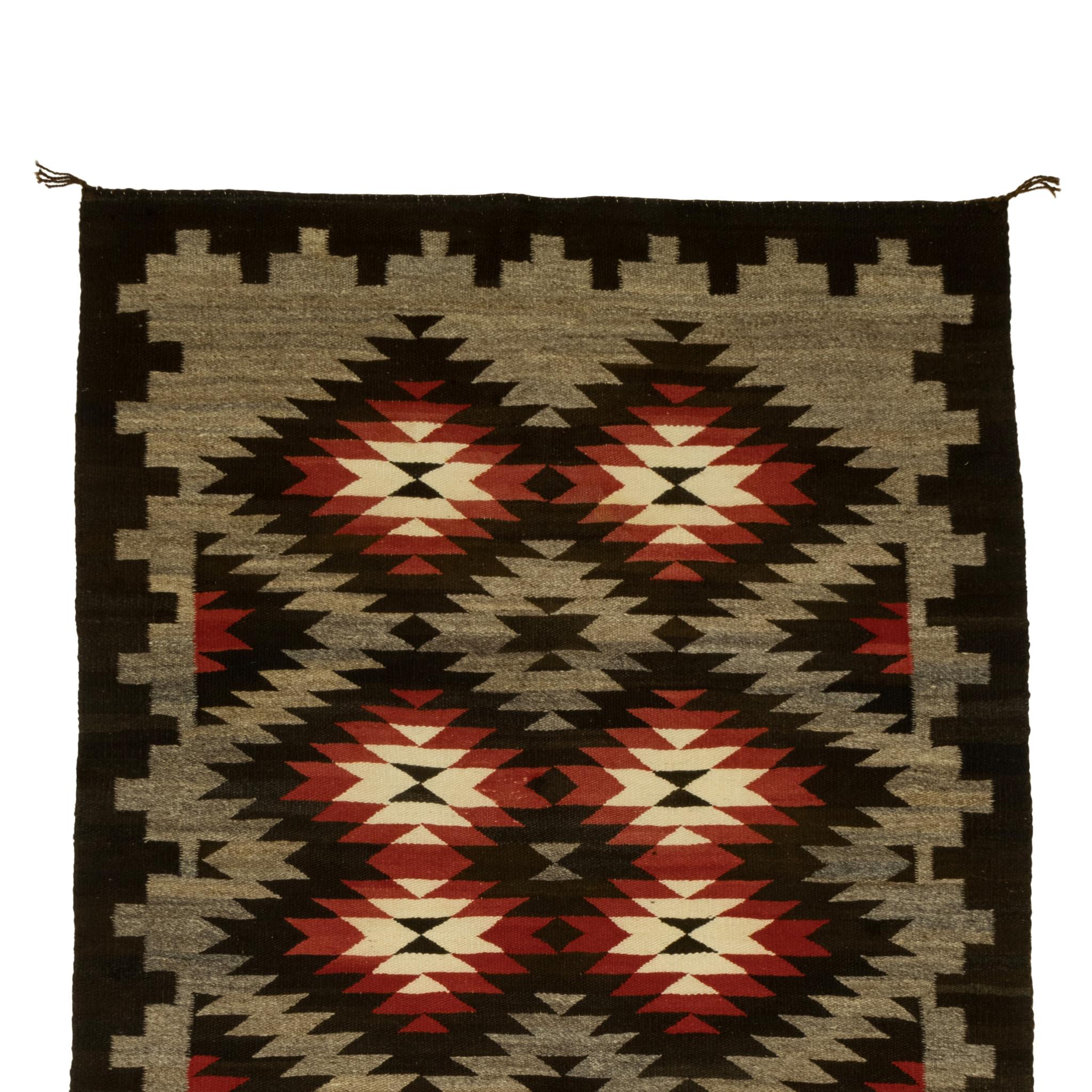 Native American Navajo crystal weaving. Featuring classic crystal design in colors of grey, black, white, and red. Bold and dark Great for floor or wall display in a Southwestern style home or handmade indigenous weaving collection. Circa 1920.
