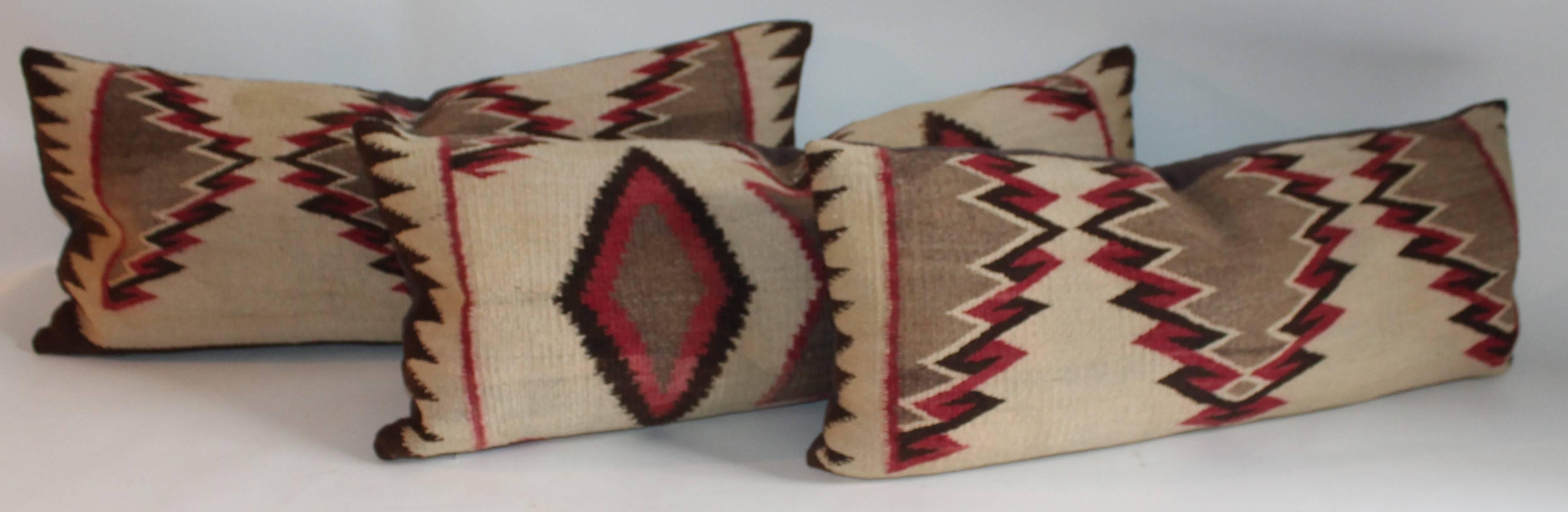 These very early saddle blanket weaving pillows are in good condition and have brown cotton linen backings. These Fine eye dazzler pillows are in such unusual colors. Sold as a group of three or 1195.00 each.