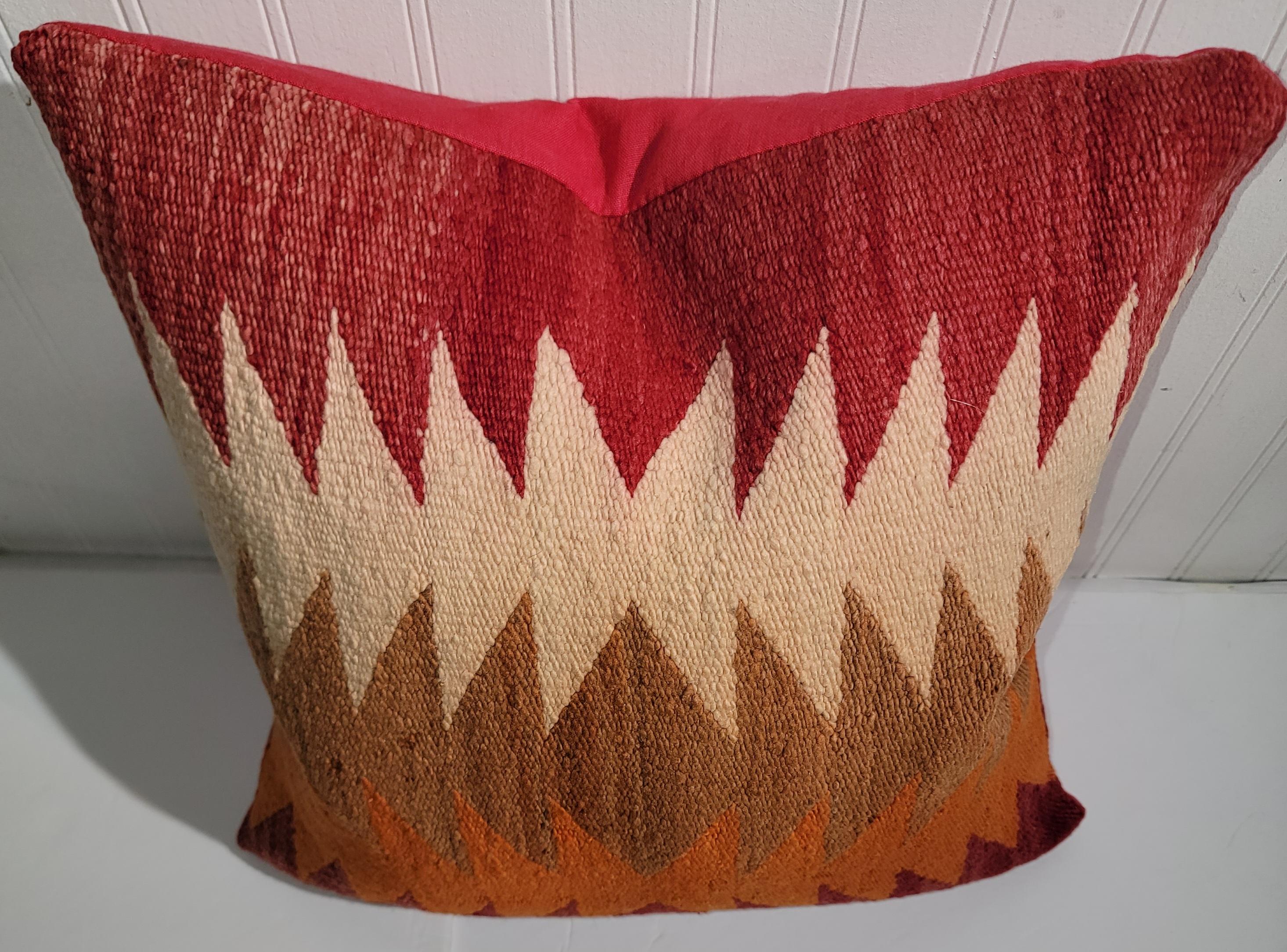 Wool Navajo Flame Stitch Pattern pillow with red linen backing. Great color in a flame pattern. Beautiful oranges and reds, whites and browns. Wonderful design. 