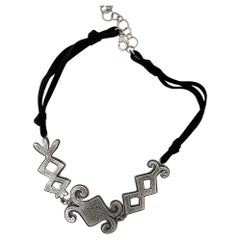 Navajo Geometric necklace by Melanie Yazzie, cast sterling silver, leather cord